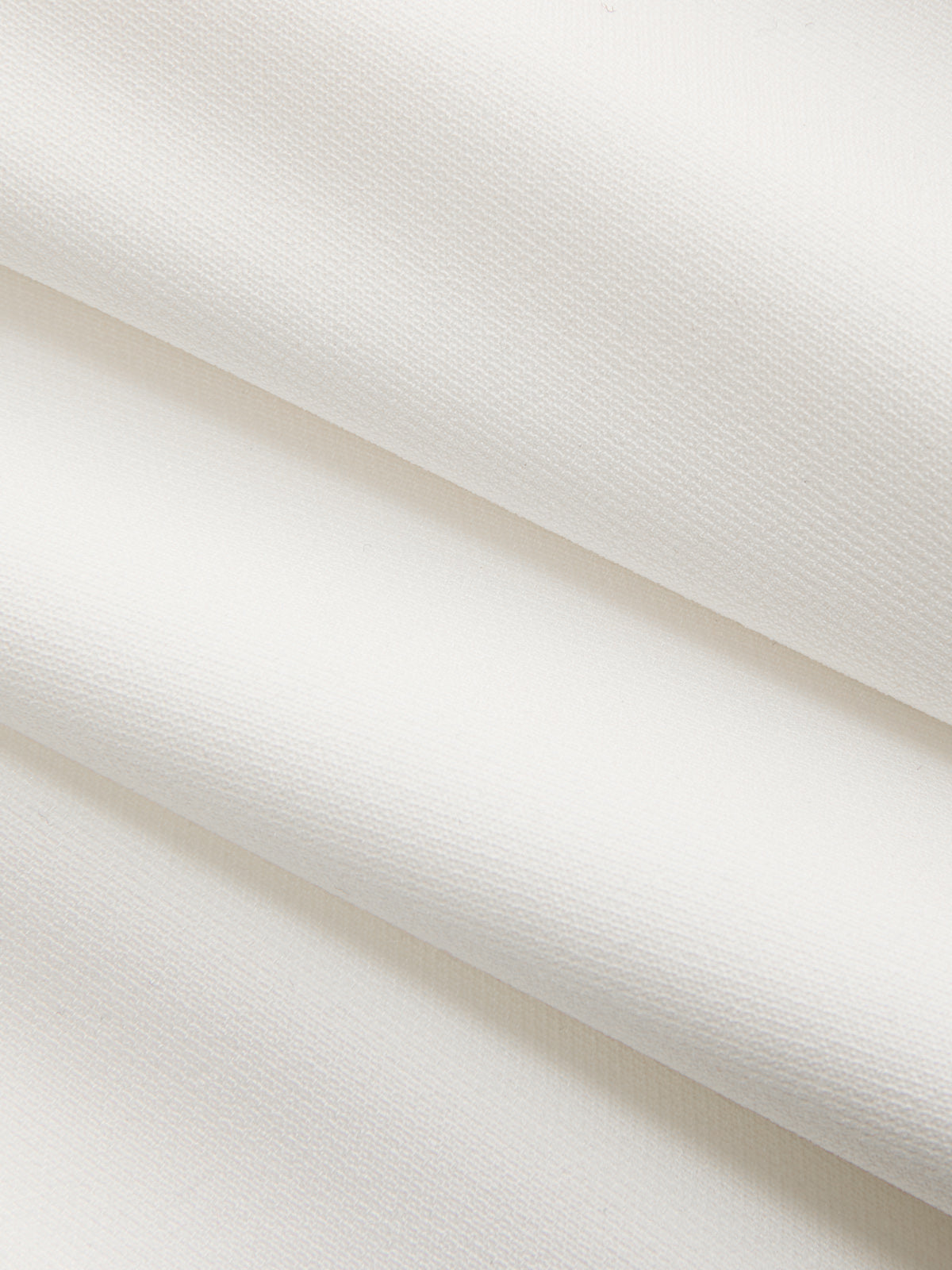 Hermine white mini dress, close-up of the plain bodice fabric