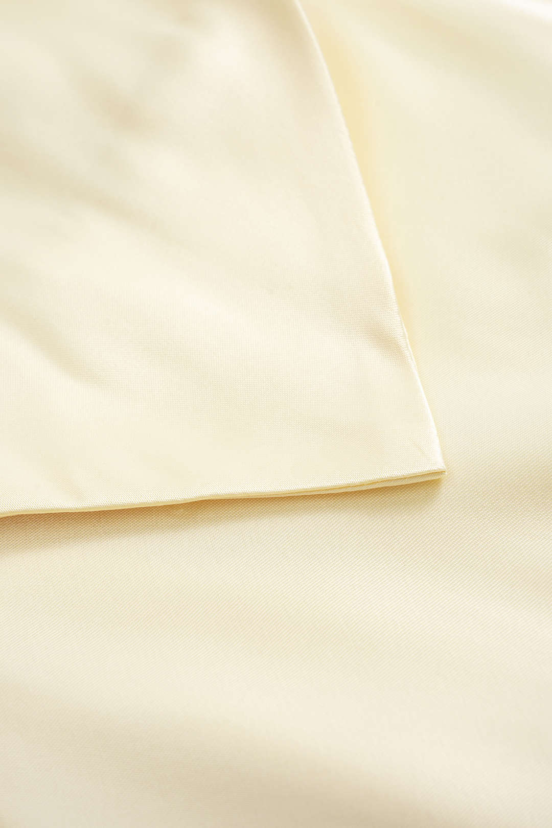 Champagne midi dress, close-up of the stitched hem edge