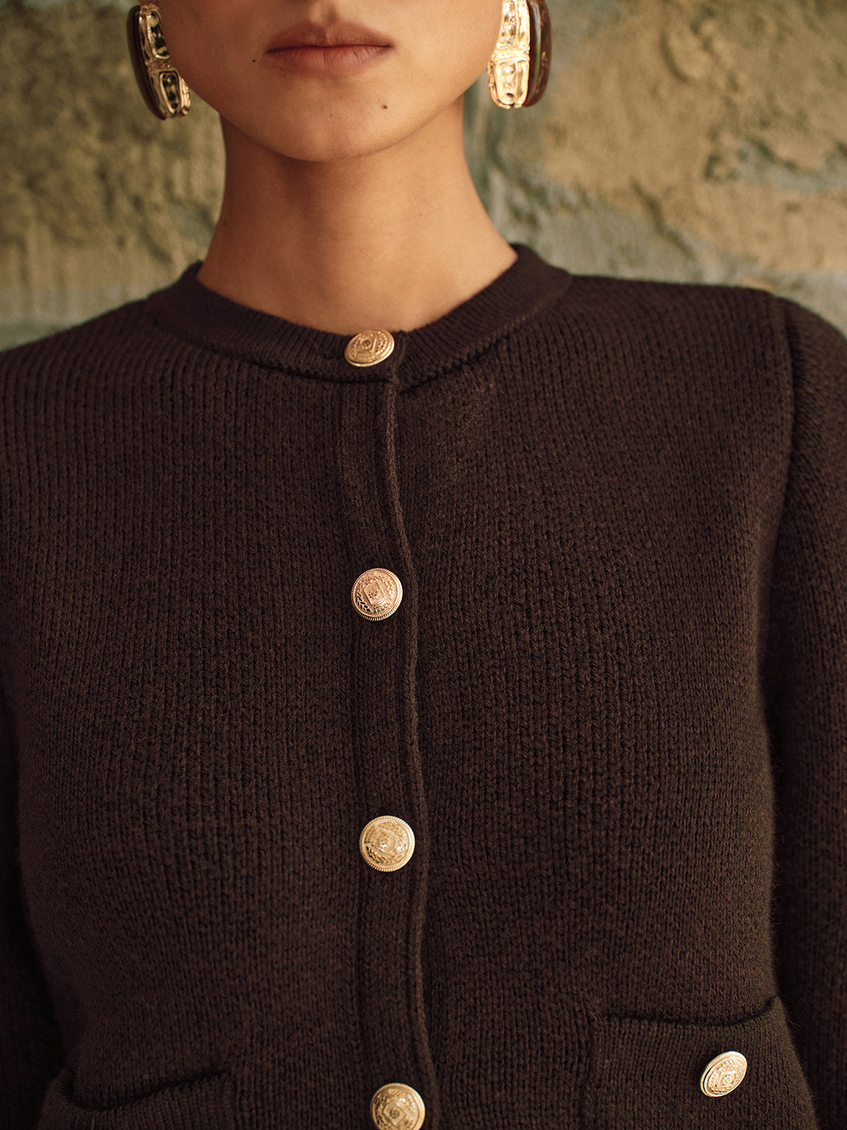 Adrienne brown cropped cardigan, close-up of the crested gold buttons