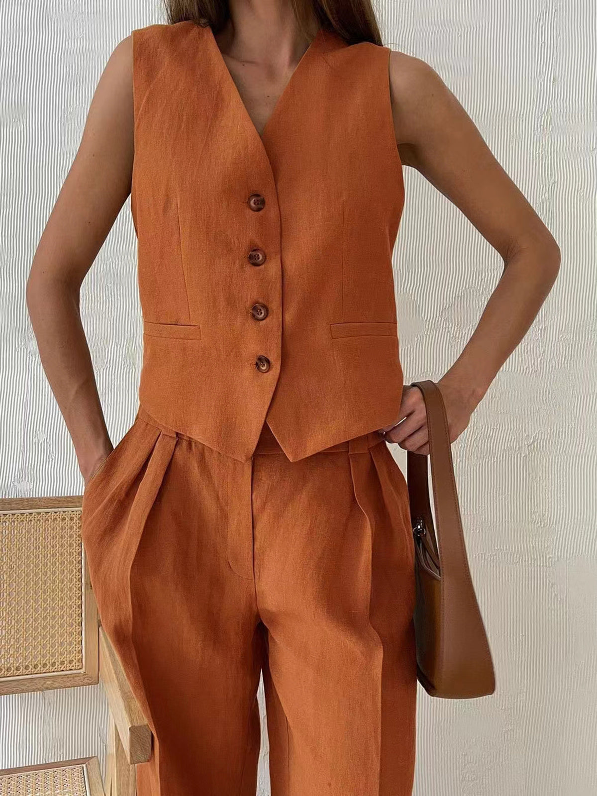 Alix terracotta waistcoat and pleated wide-leg trousers, cropped front view