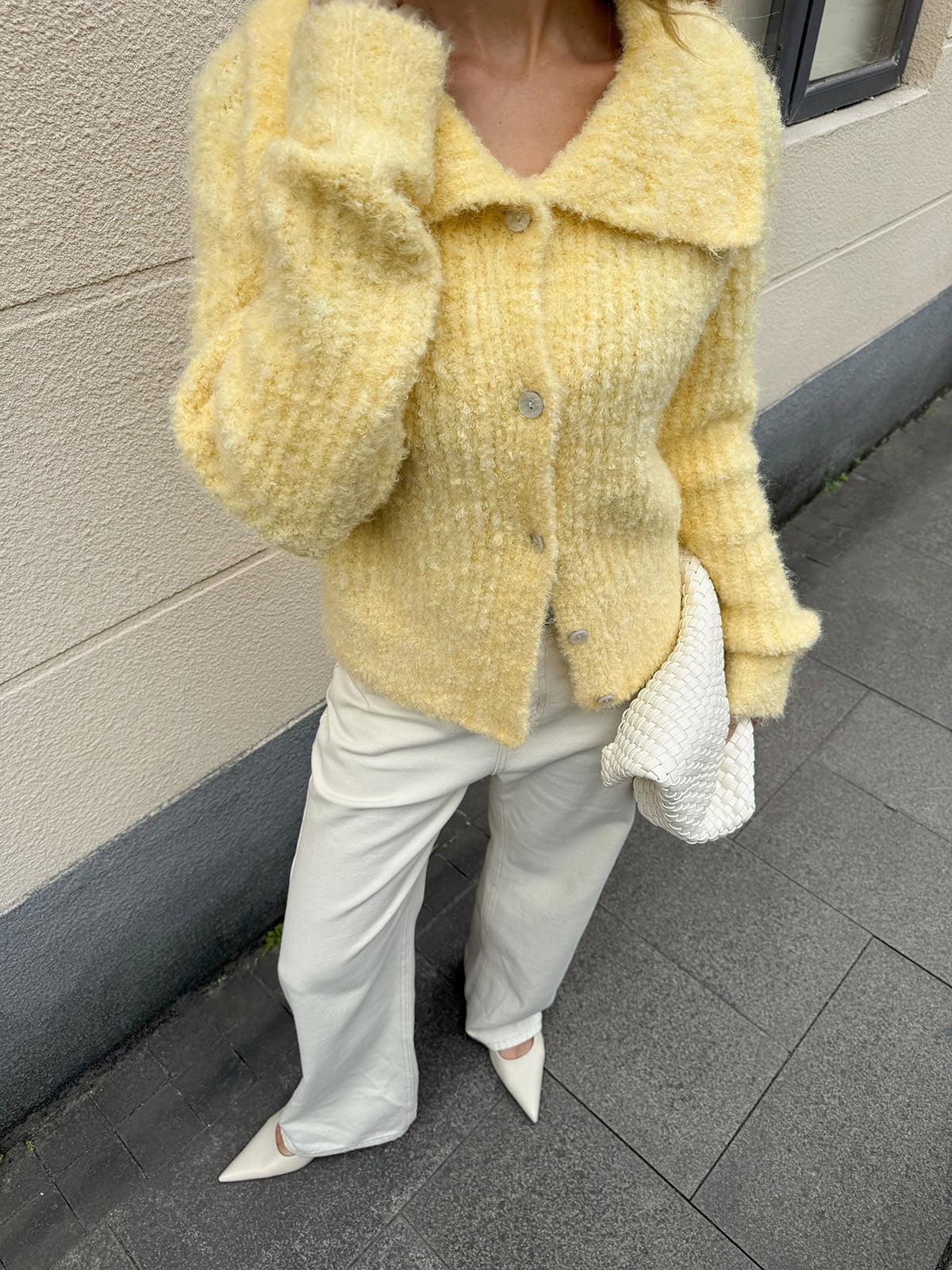 Arielle yellow cardigan, close-up of the buttons fastened down the front
