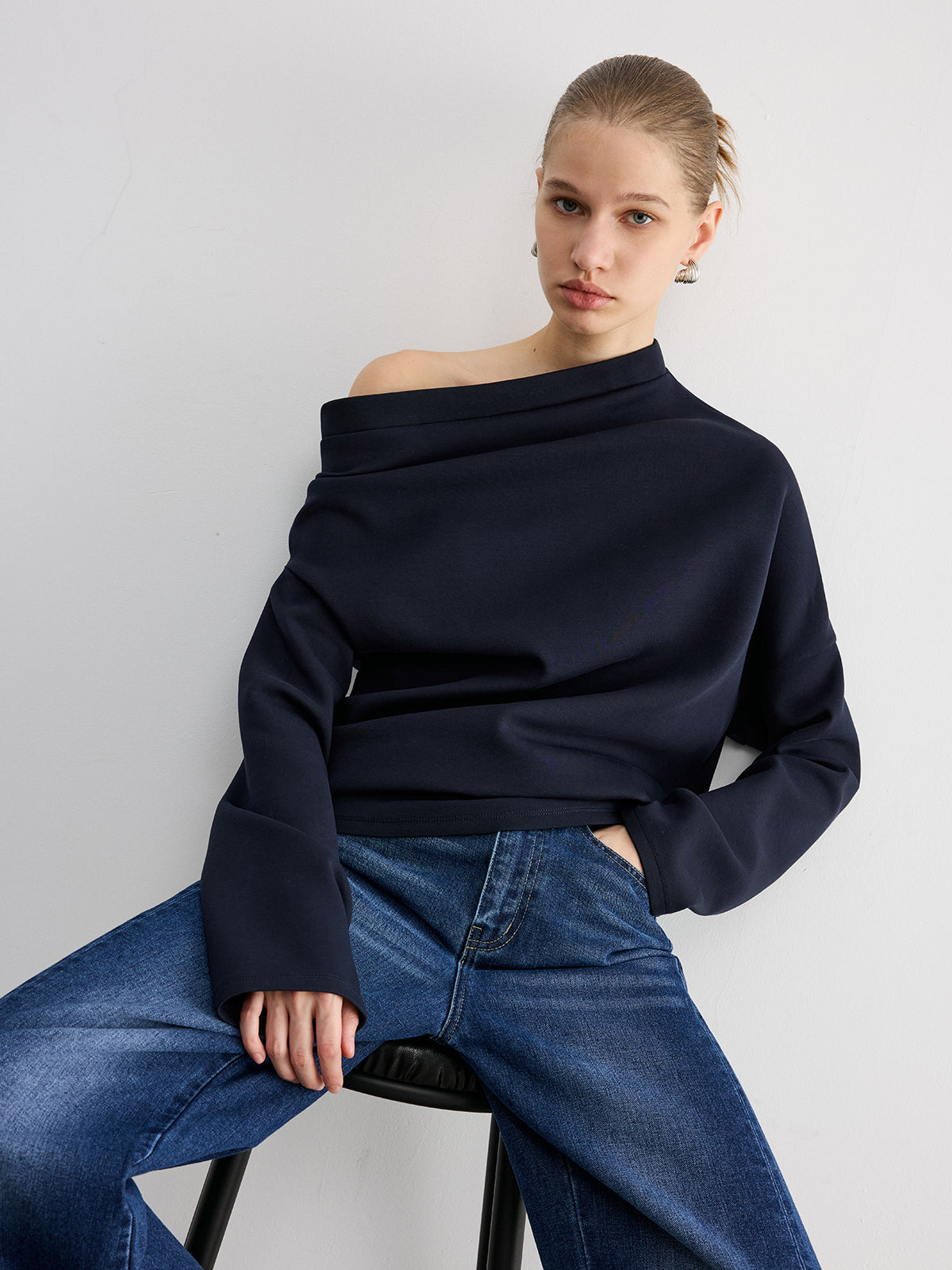 Augustine navy asymmetric off-shoulder sweatshirt, three-quarter view