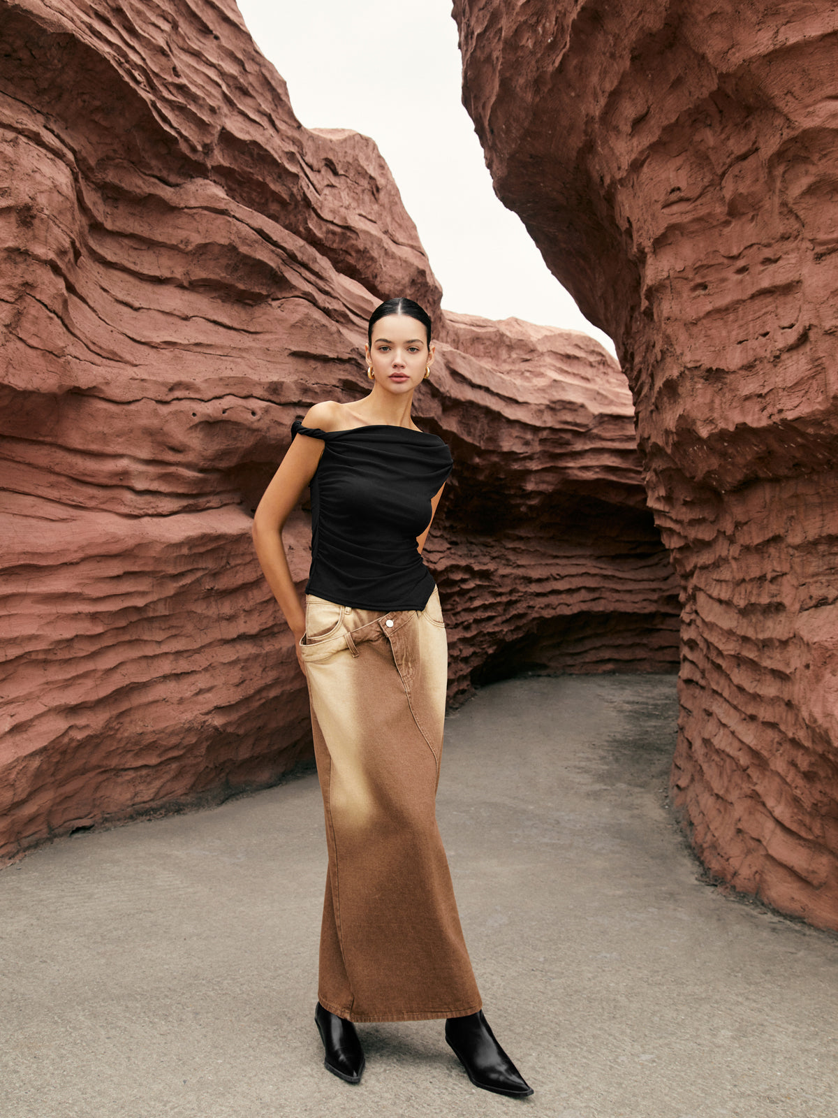 Capucine black one-shoulder draped top, full-length view