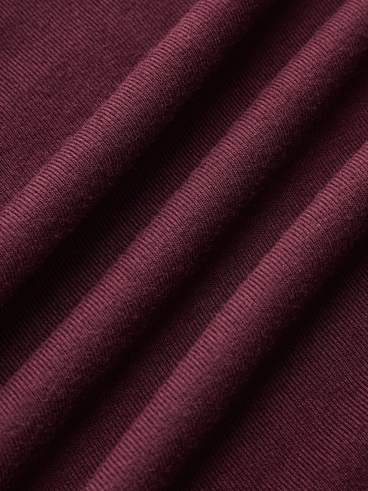 Daphne burgundy ruched maxi dress, close-up of the fine knit surface