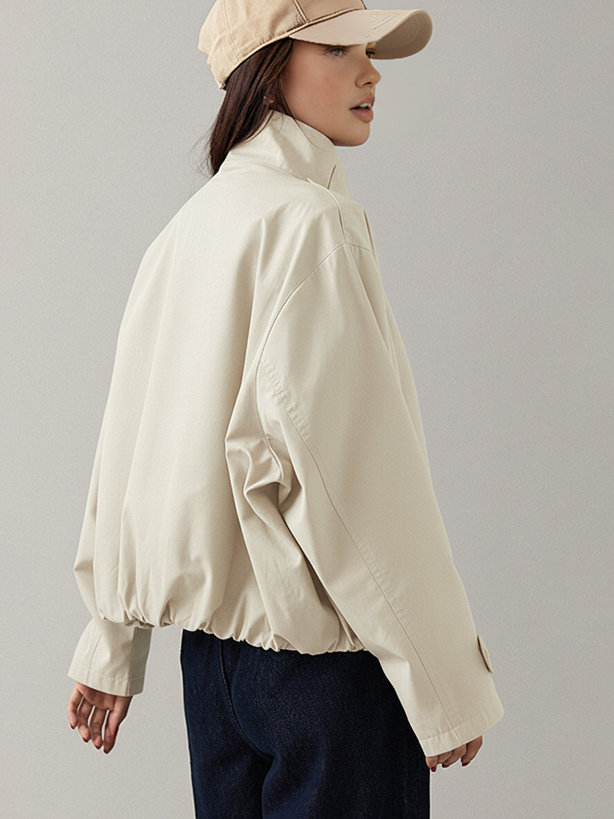 Edmee Cream cropped jacket, back view showing the elasticated hem