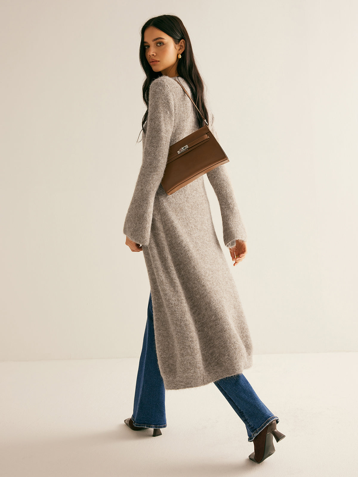 Eglantine taupe longline cardigan worn open over jeans, full-length view