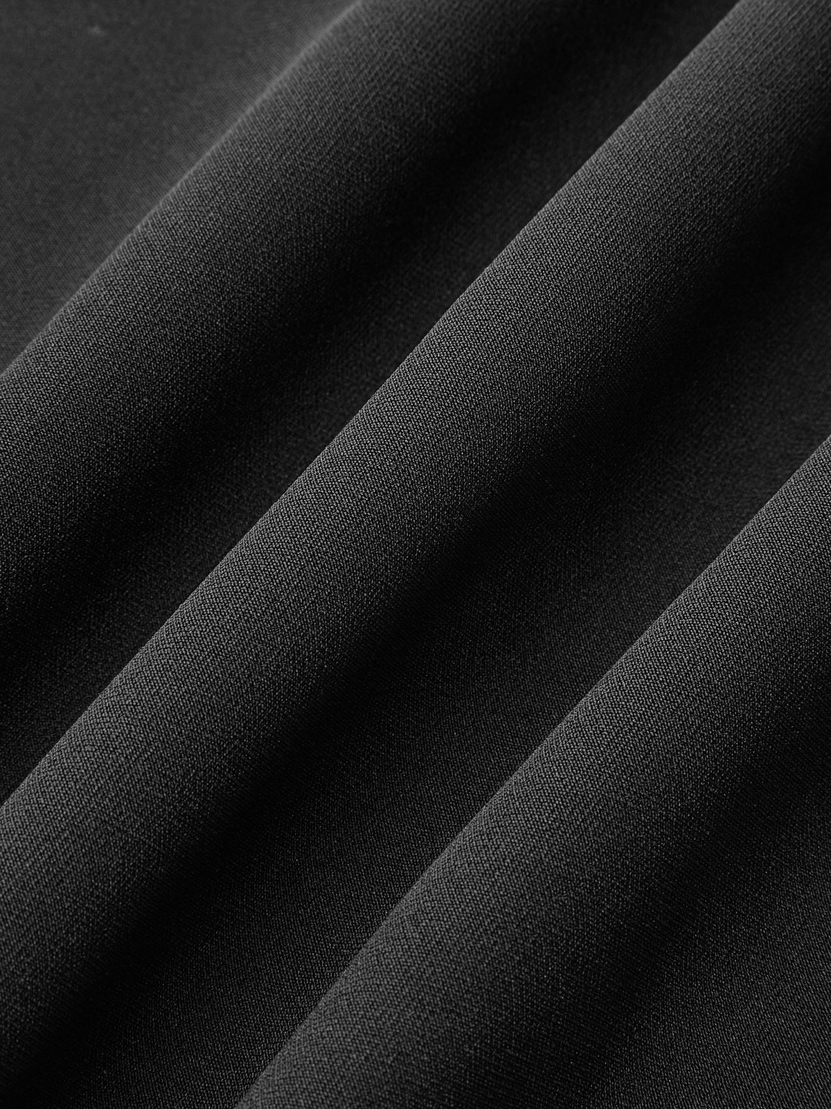 Elodie black bow dress, close-up of the fabric