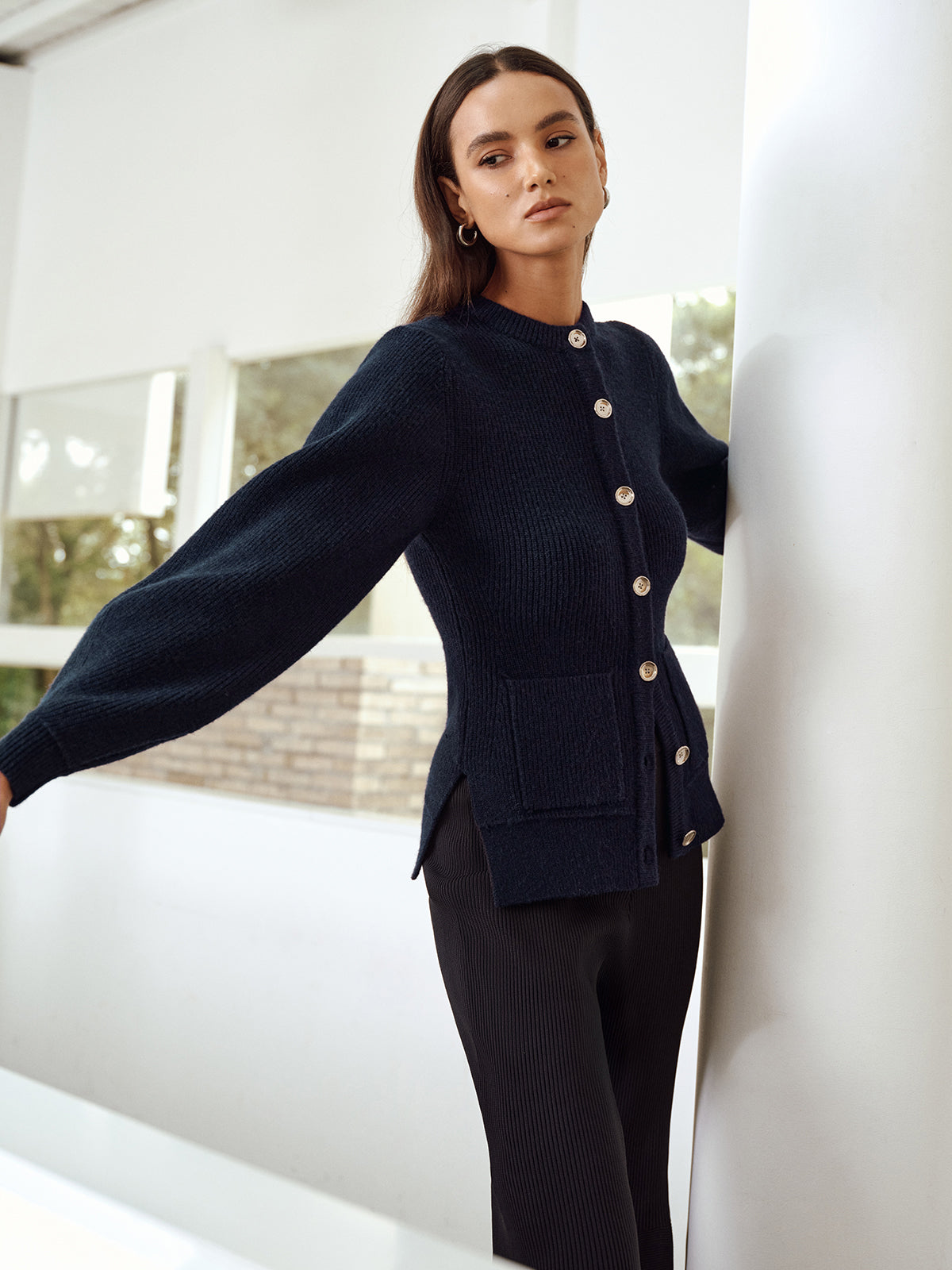 Ernestine navy cardigan showing the raised shoulder and sleeve