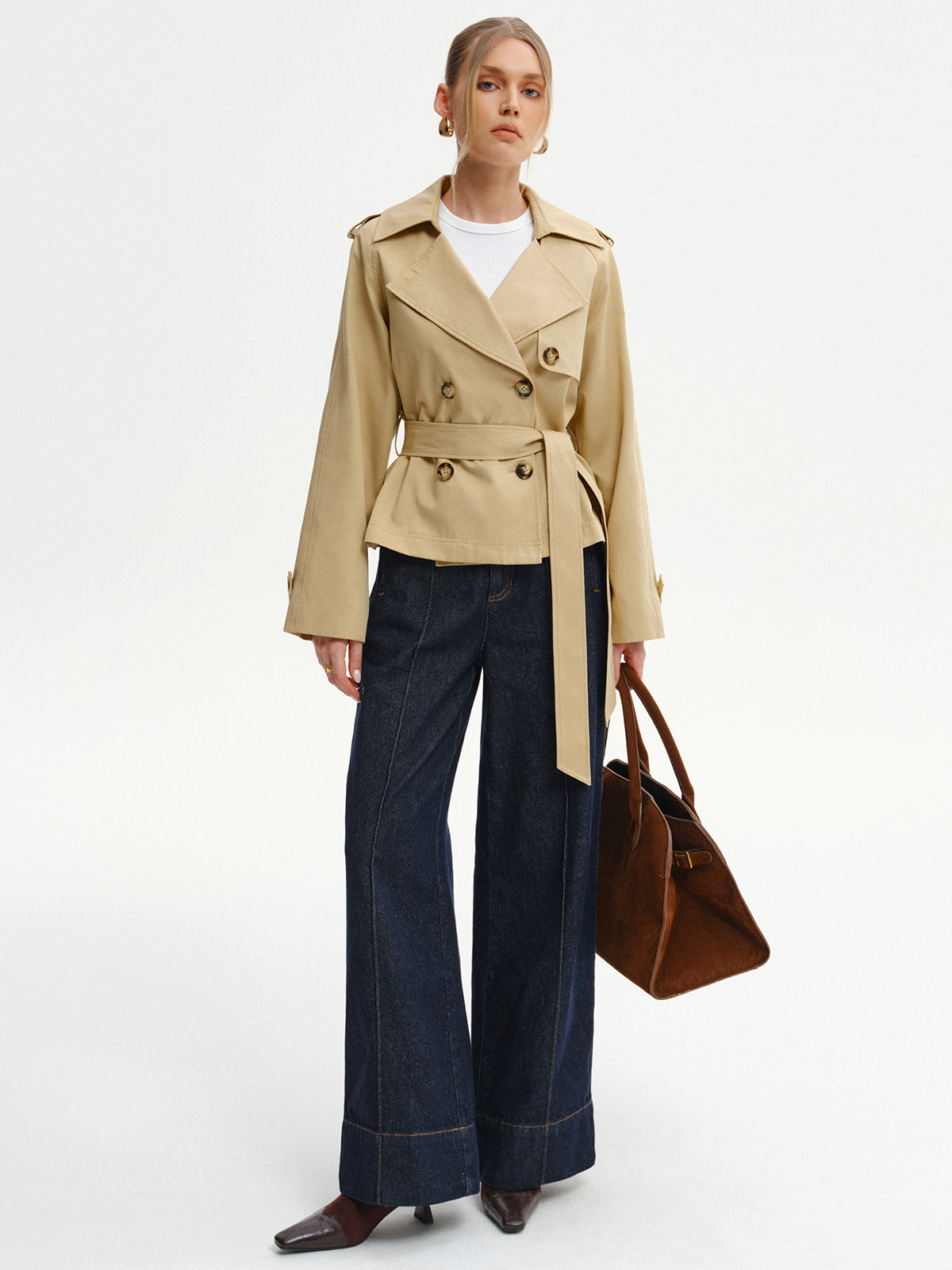 Khaki short trench coat styled with jeans, full-length front view