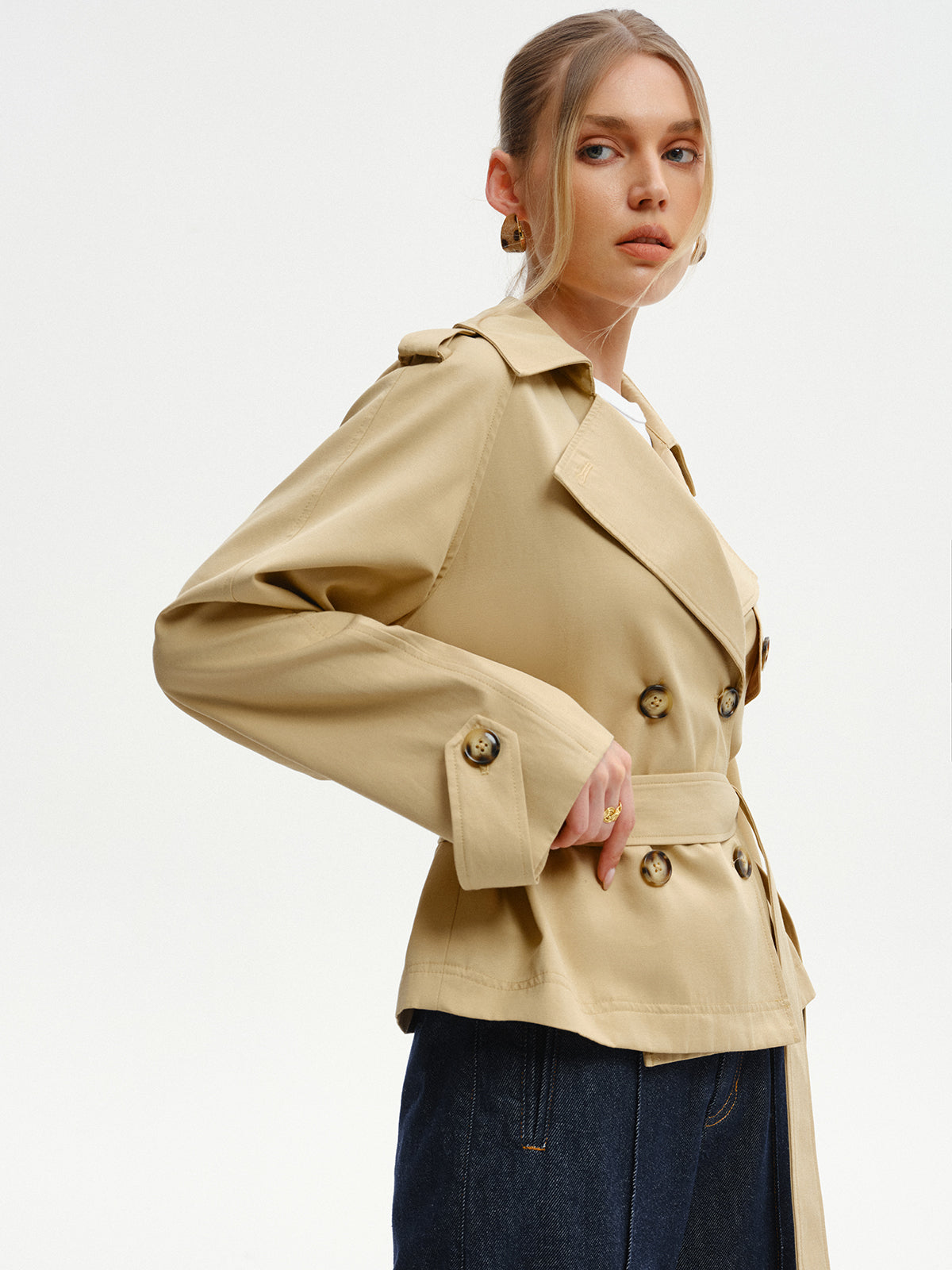 Khaki belted trench jacket seen from the side