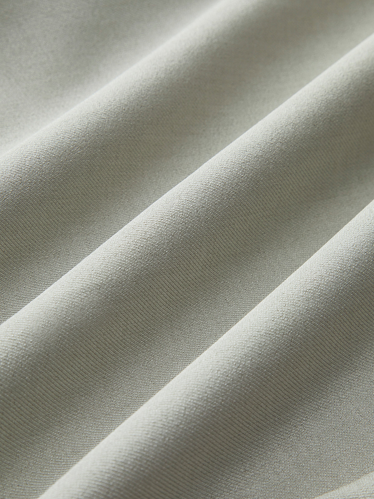 Flavie stone waistcoat and trouser set, close-up of the matte twill weave