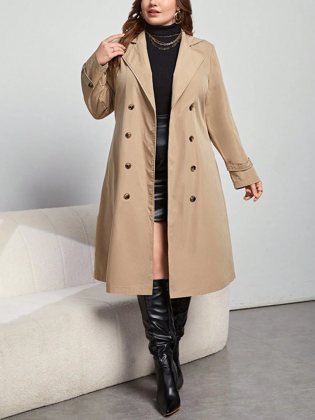 Henriette khaki trench coat shown with the lapel collar turned up