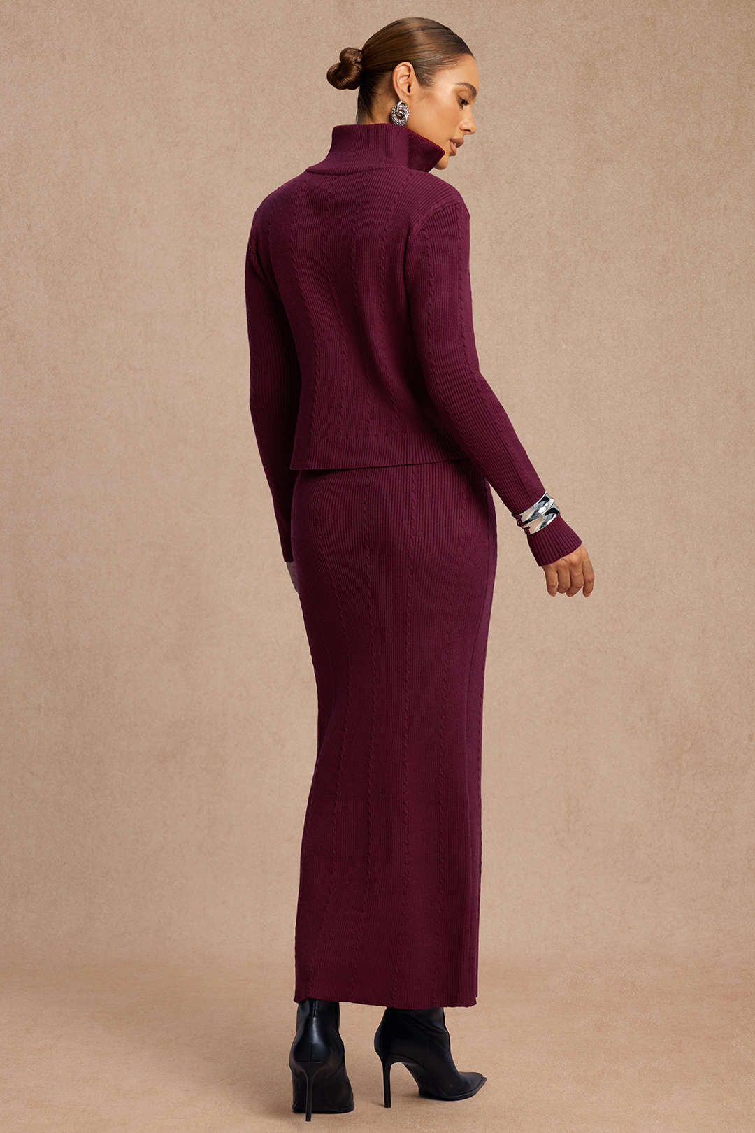 Back view of the burgundy ribbed knit jacket and maxi skirt set