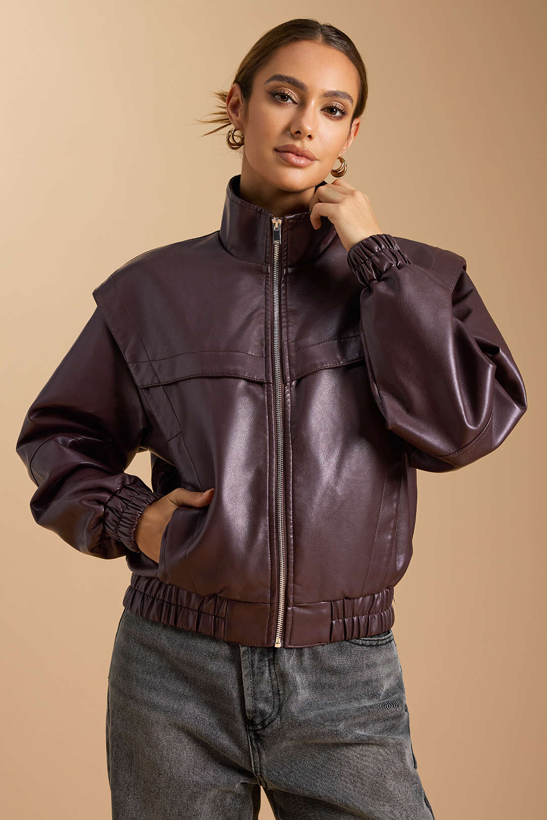 Ines brown zip-front bomber jacket with the collar up, front view