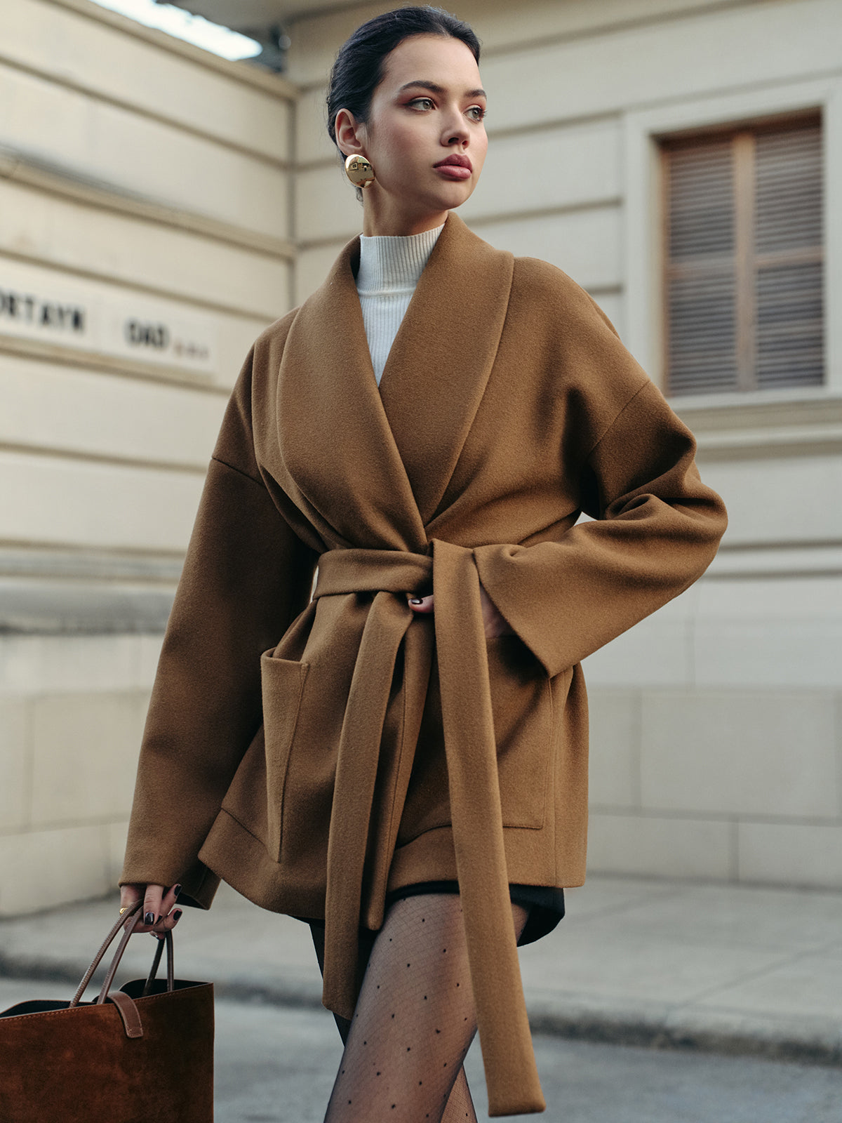 Leopoldine camel wrap coat showing the rolled shawl collar