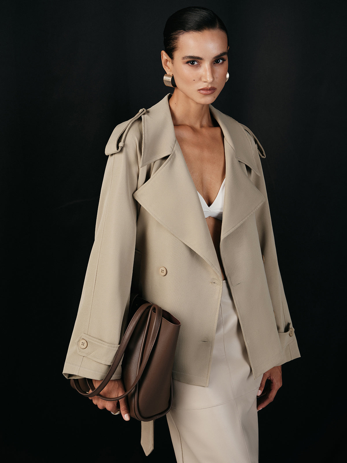 Khaki tie-waist jacket worn open over a white top, front view