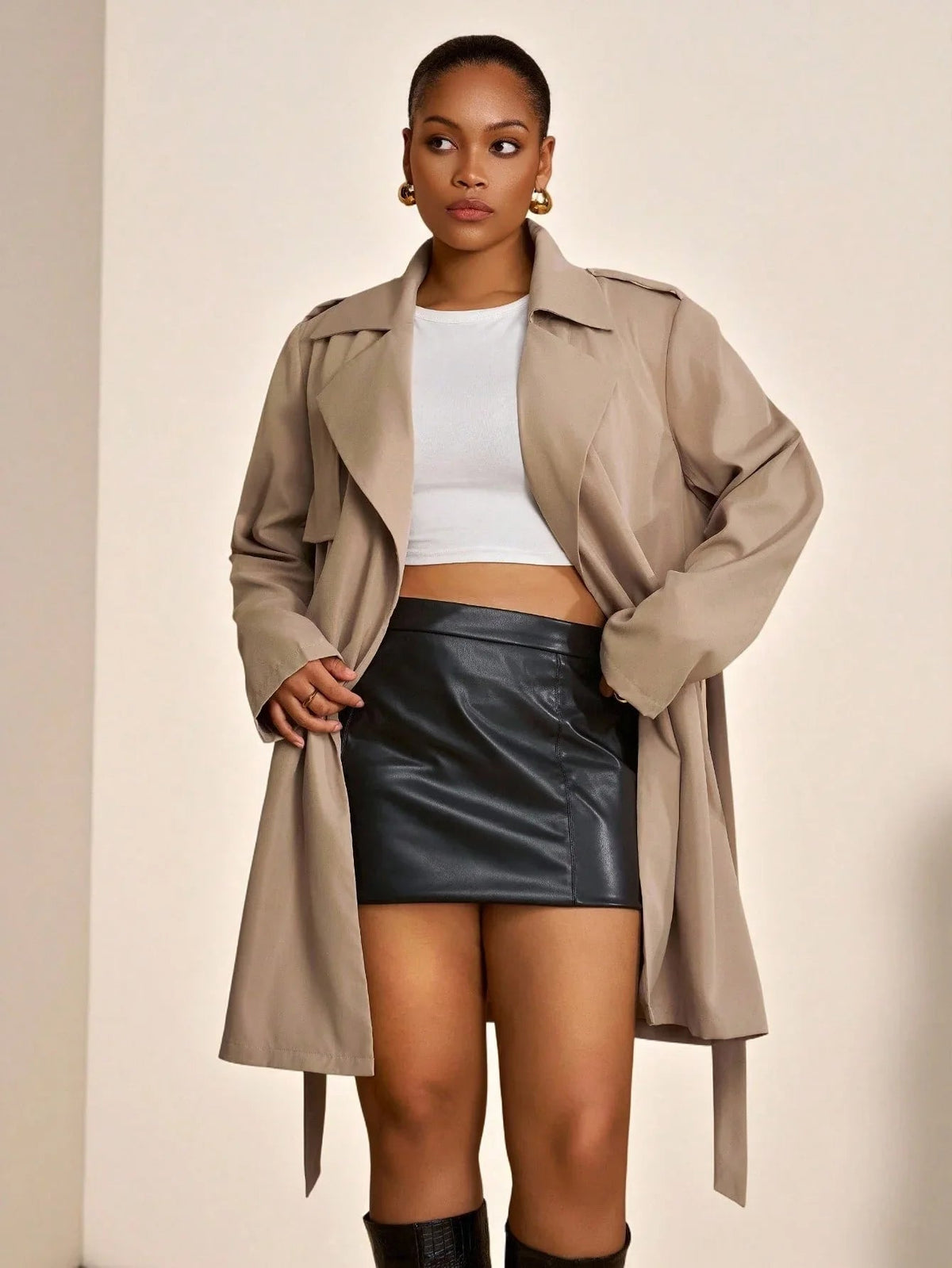 Mathilde khaki trench coat showing the loose lapel collar and tie belt