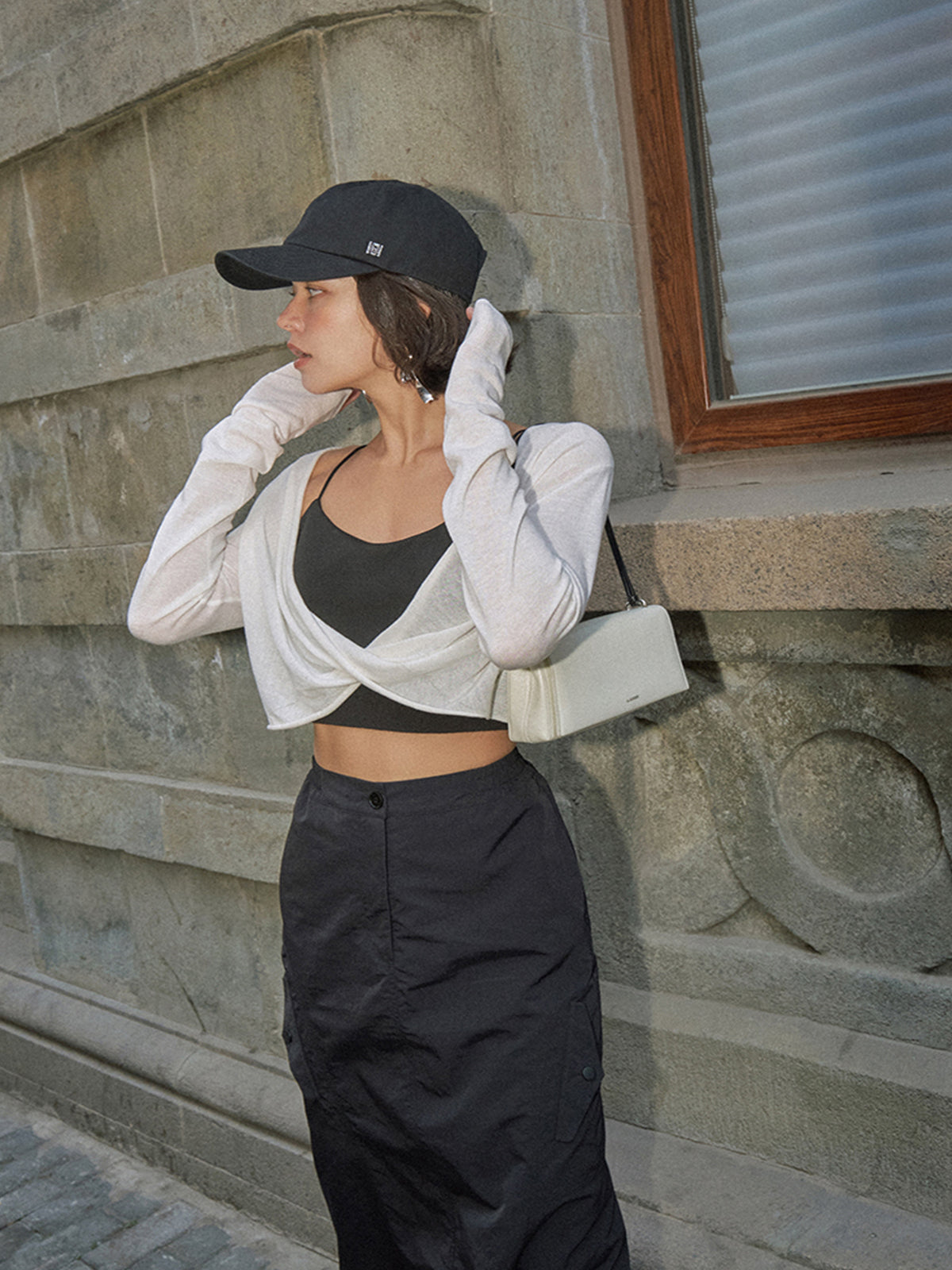 Odette white cropped knit top, back view showing the boat neckline