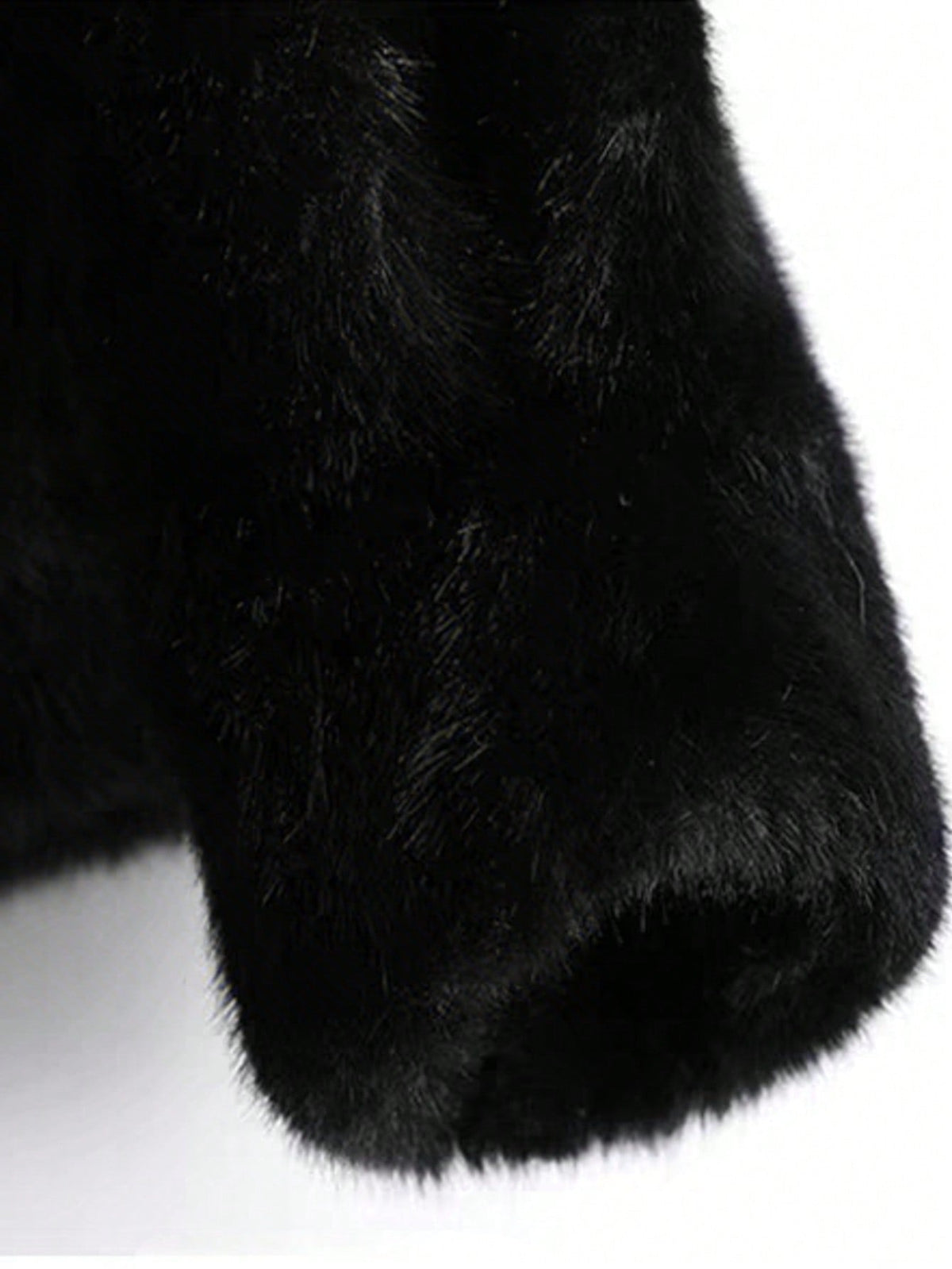 Close-up of the faux fur sleeve on the Solange coat