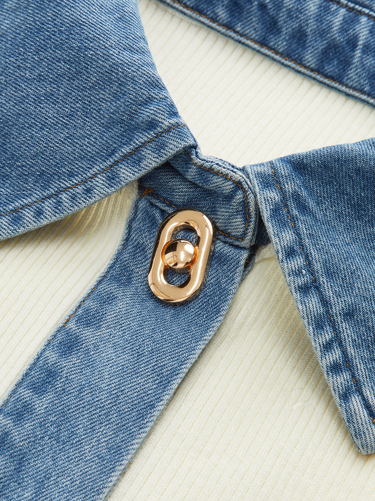 Sylvette cream and blue sweater, close-up of the topstitched denim front strip