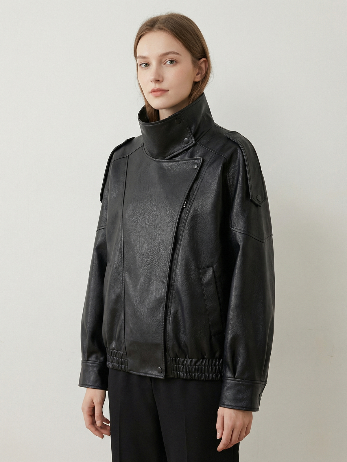 Victoire black faux leather bomber jacket with a funnel neck, front view