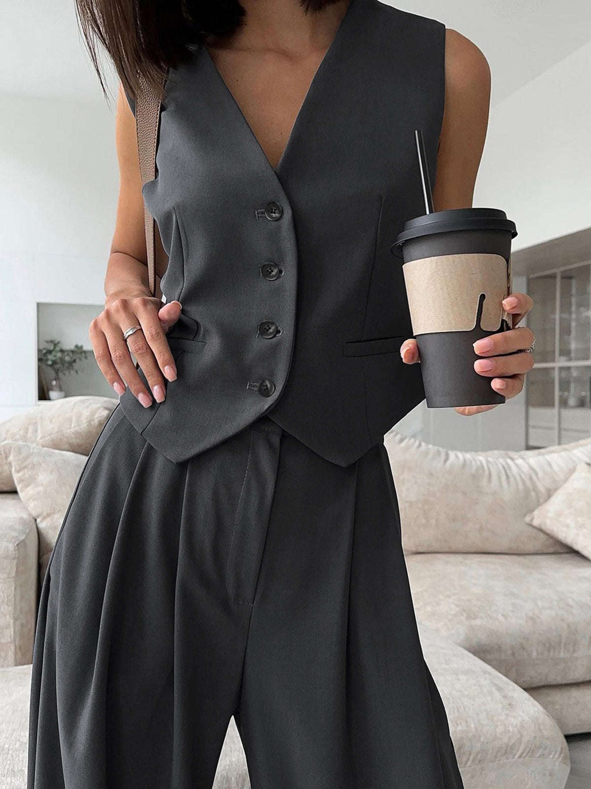 Zoe charcoal waistcoat and wide-leg trouser set, close-up of the buttoned waistcoat front
