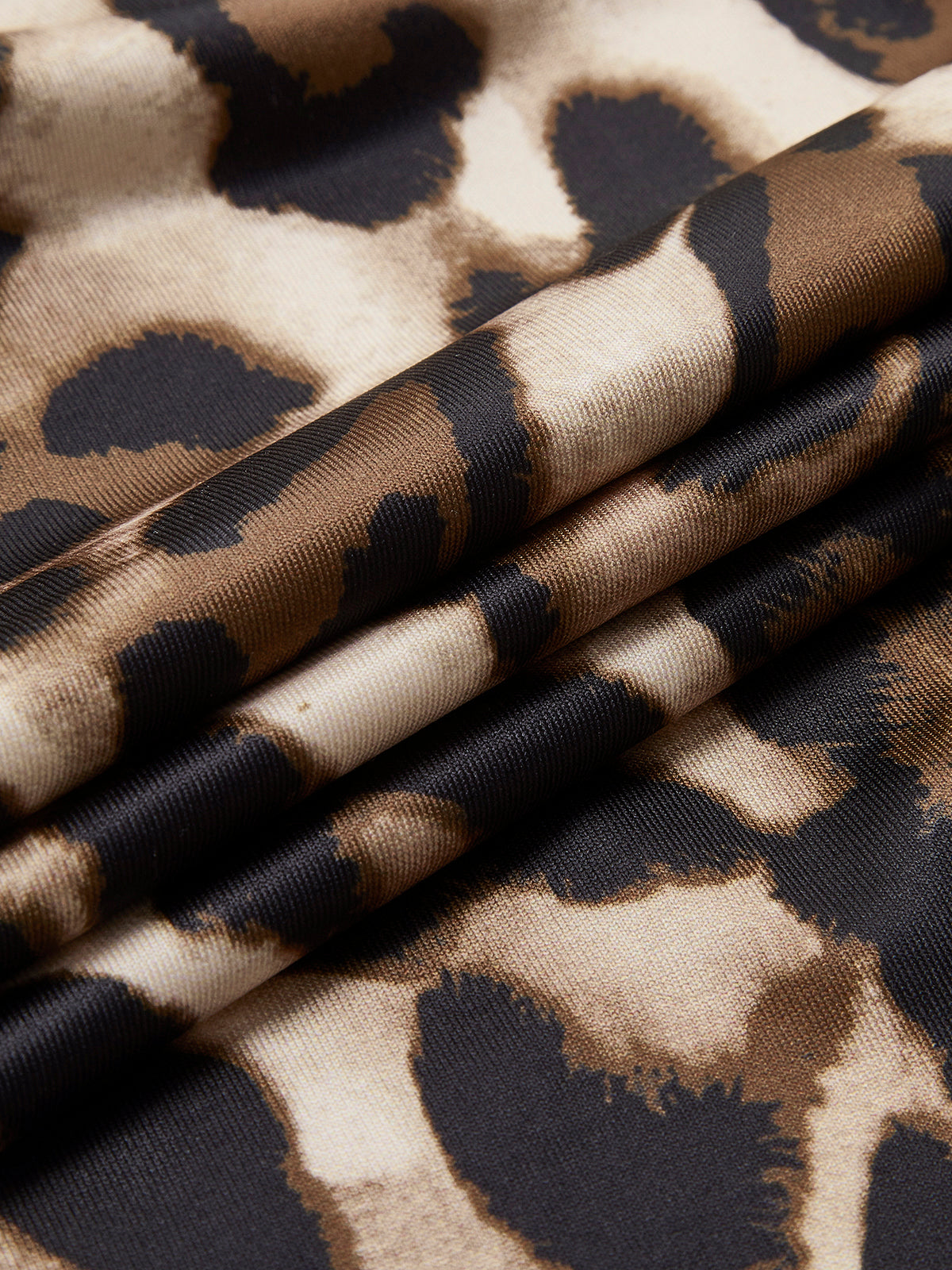 Jacqueline multicolor leopard print mini dress, folded fabric showing the scale of the leopard spots