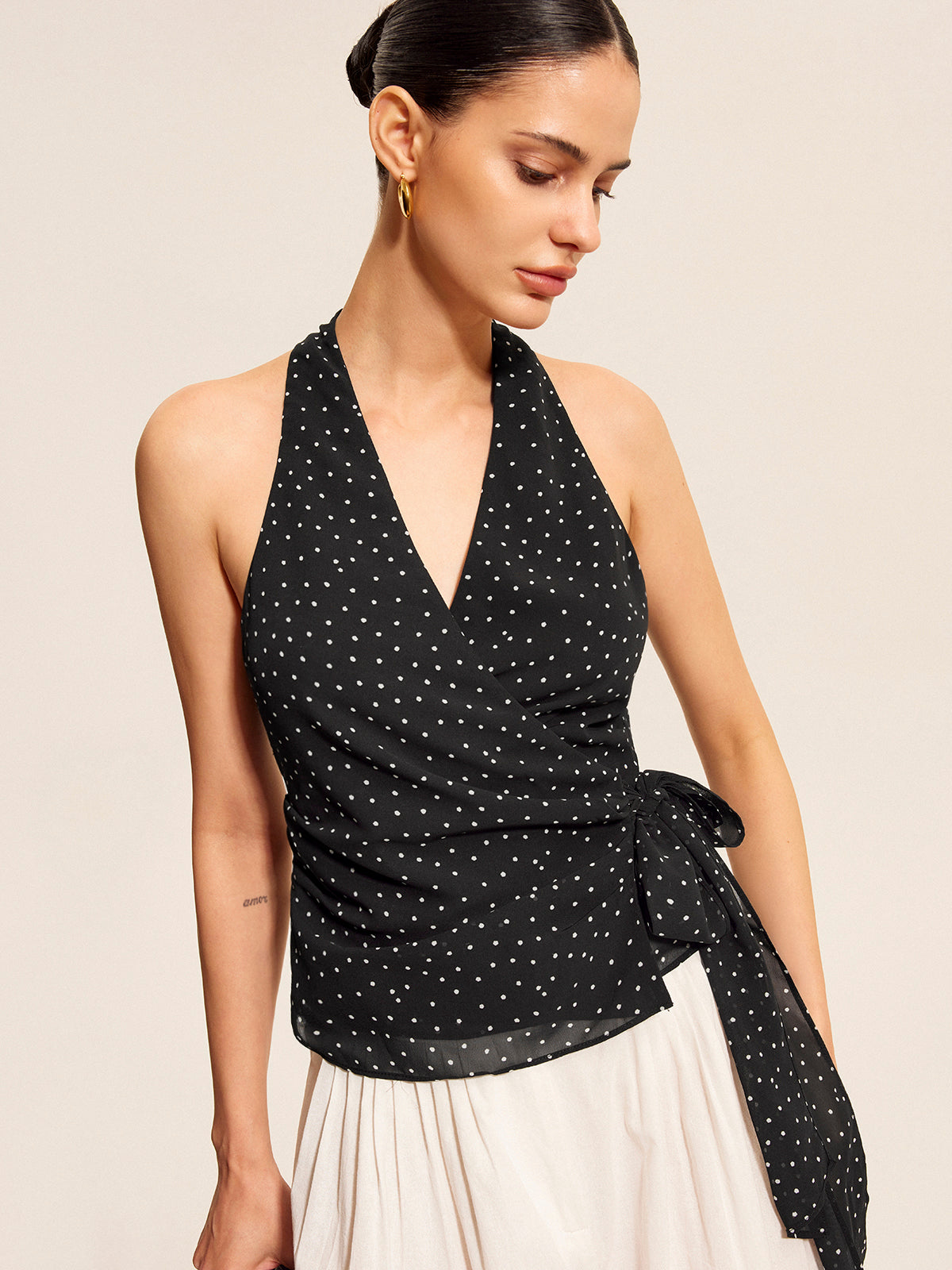 Halter top with stand collar, neckline detail
