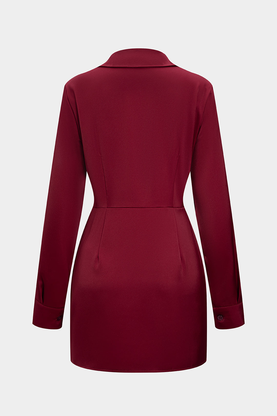 Close-up of the waist ruching on the red wrap dress