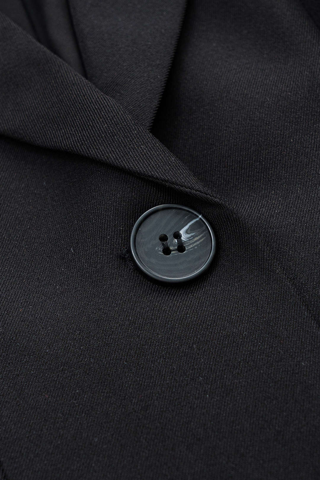 Black V-neck blazer dress, three-quarter view