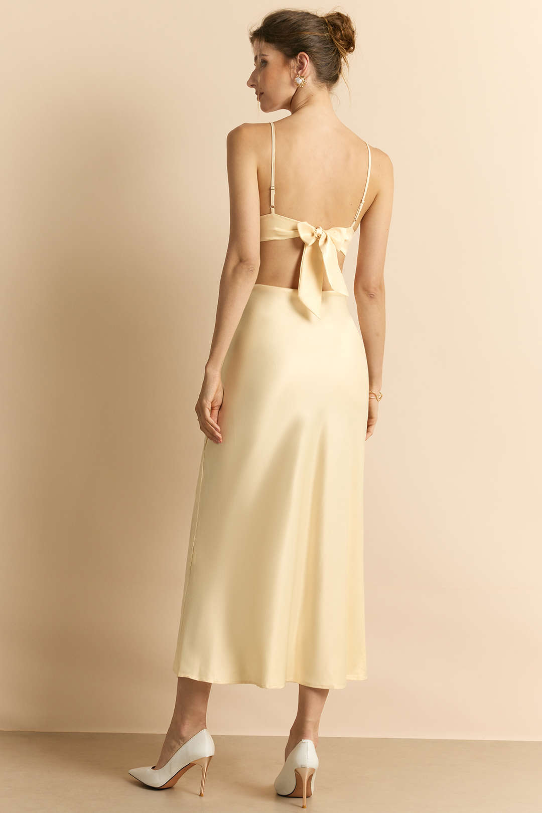 Melanie champagne midi dress, back view showing the self-tie bow and open back