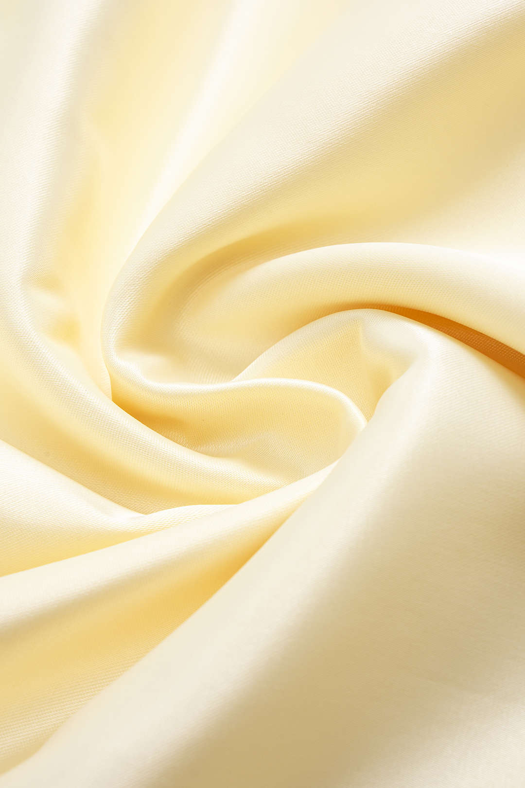 Champagne midi dress, close-up of the smooth fabric surface and its sheen