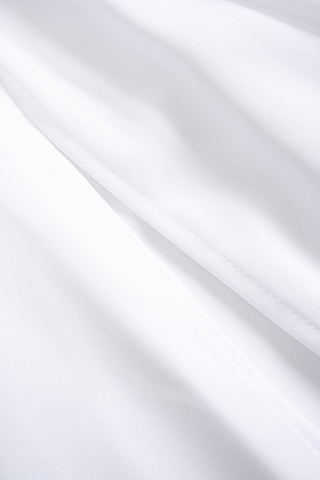 Constance maxi dress, close-up of the white skirt fabric