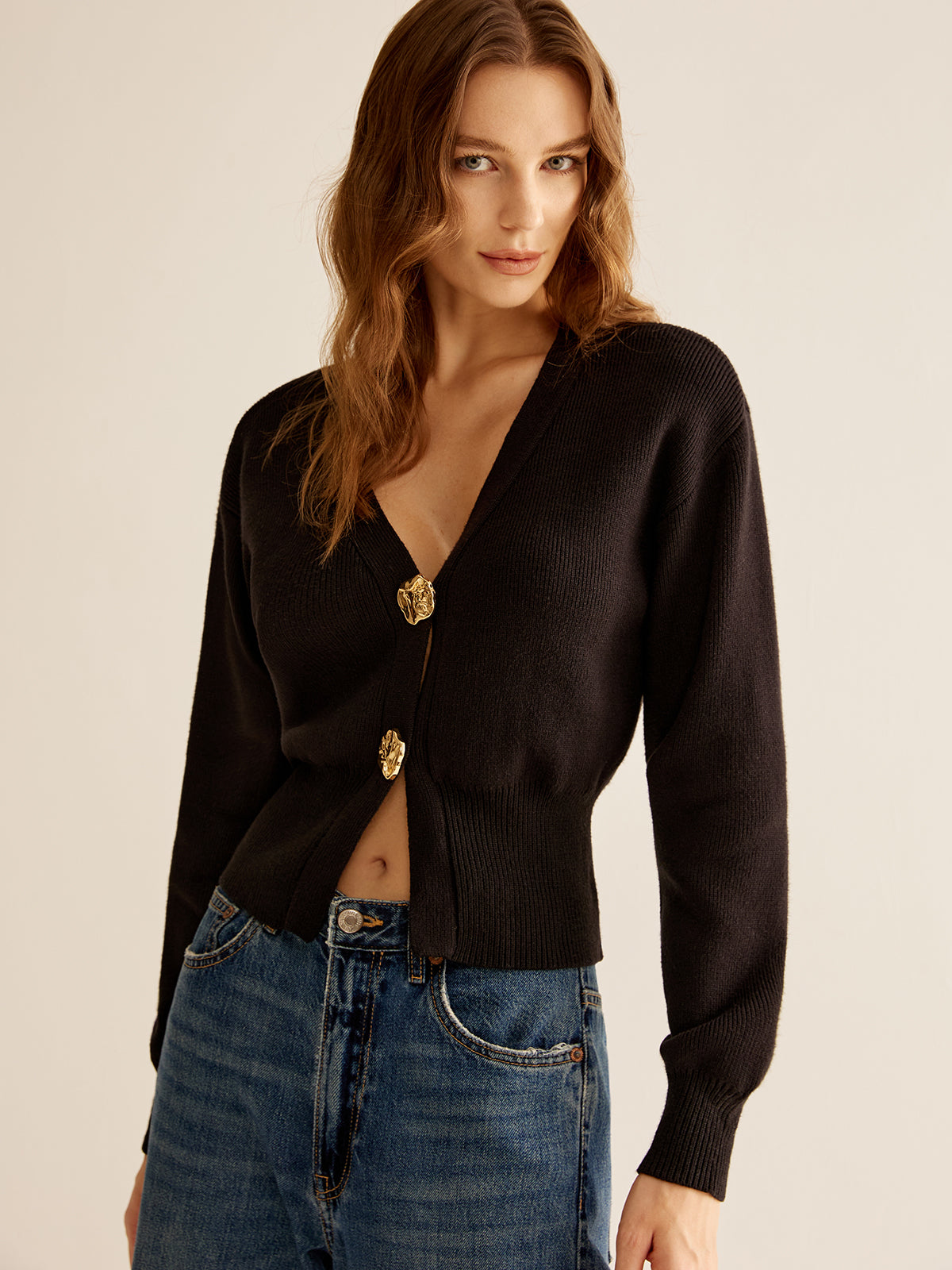Adele black cropped cardigan showing the dropped shoulder and blouson sleeve