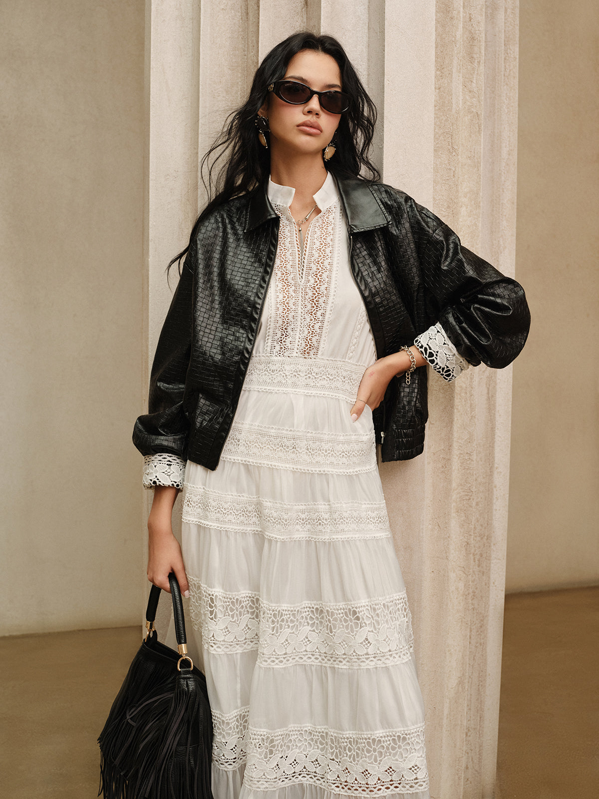 Albertine white lace maxi dress, front view styled with a leather jacket