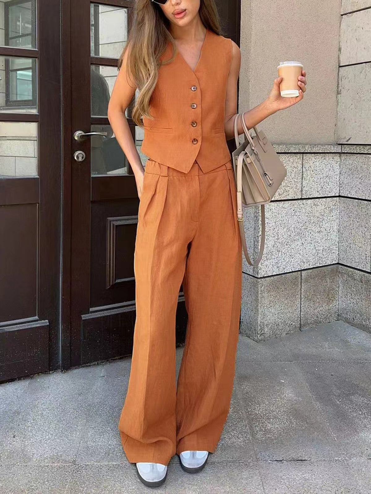 Alix terracotta linen-blend two-piece set worn in a doorway, full-length front view