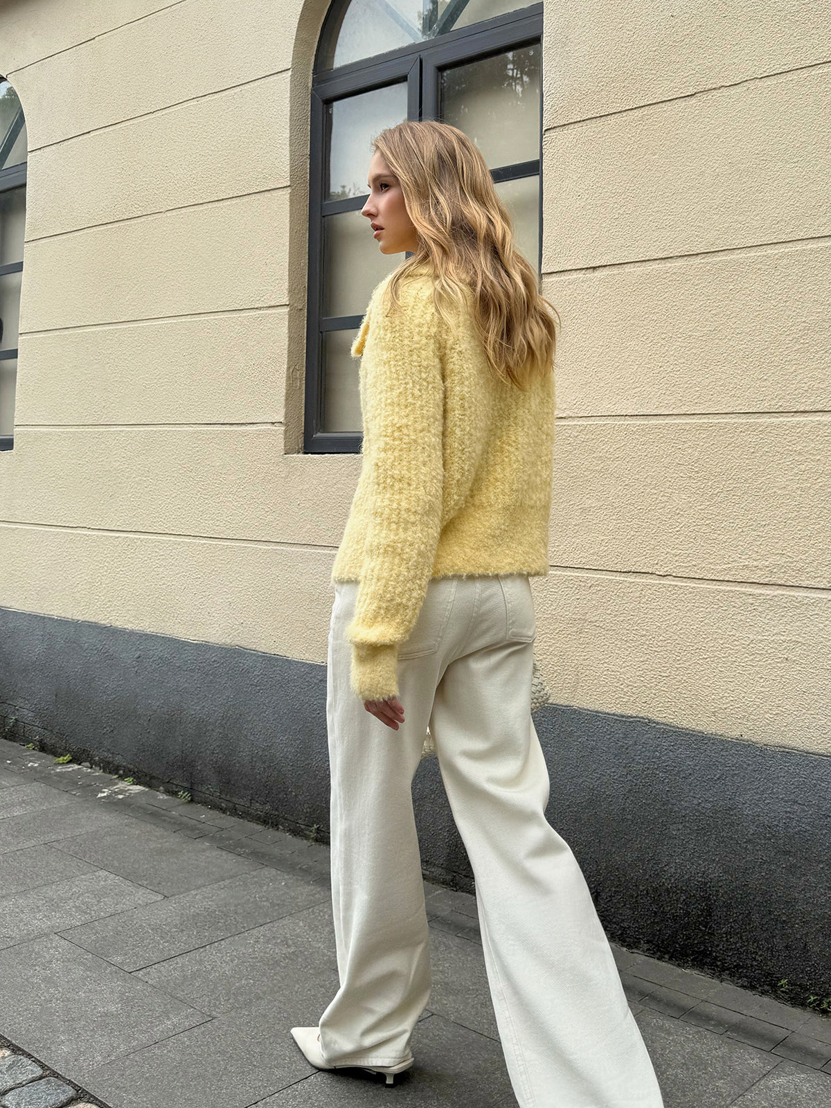 Arielle yellow cardigan, back view of the plain unbroken knit
