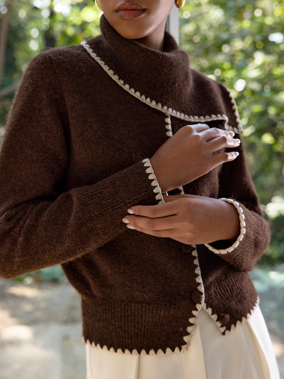Armelle brown and cream cardigan, close view of the cuff and hem crochet edging
