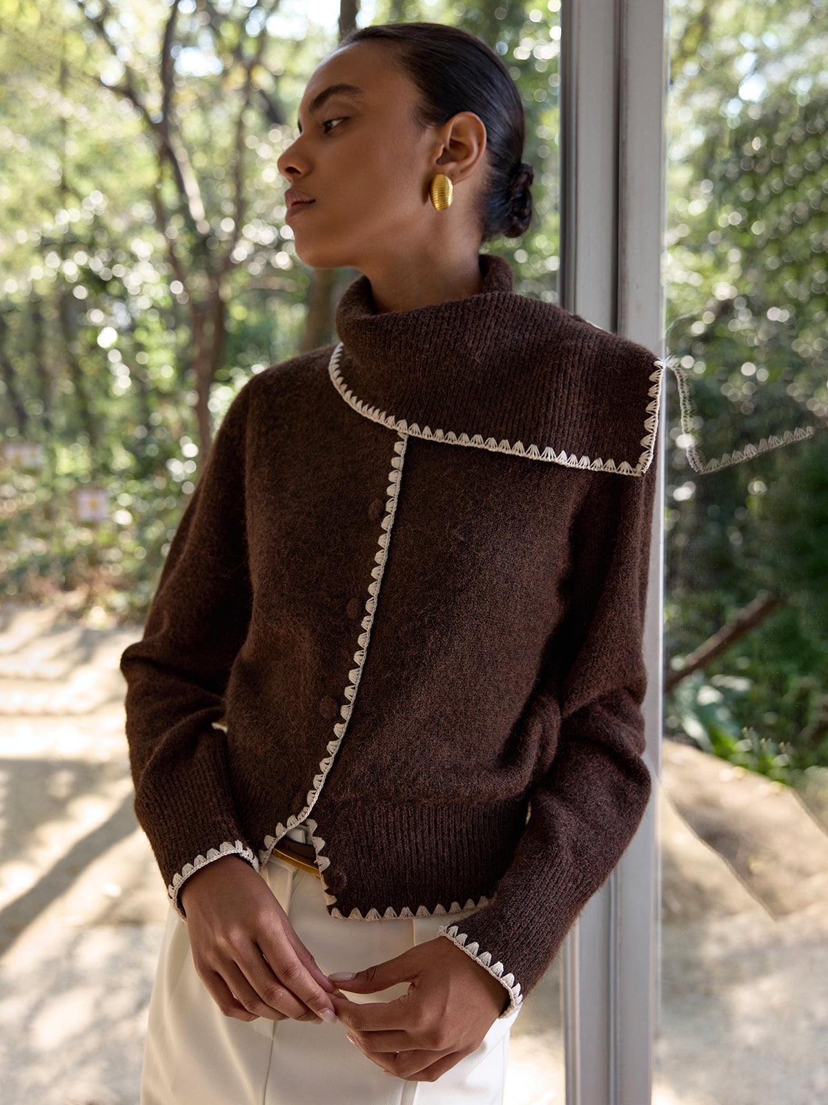 Armelle brown and cream crochet-trim cardigan, side view with the collar standing