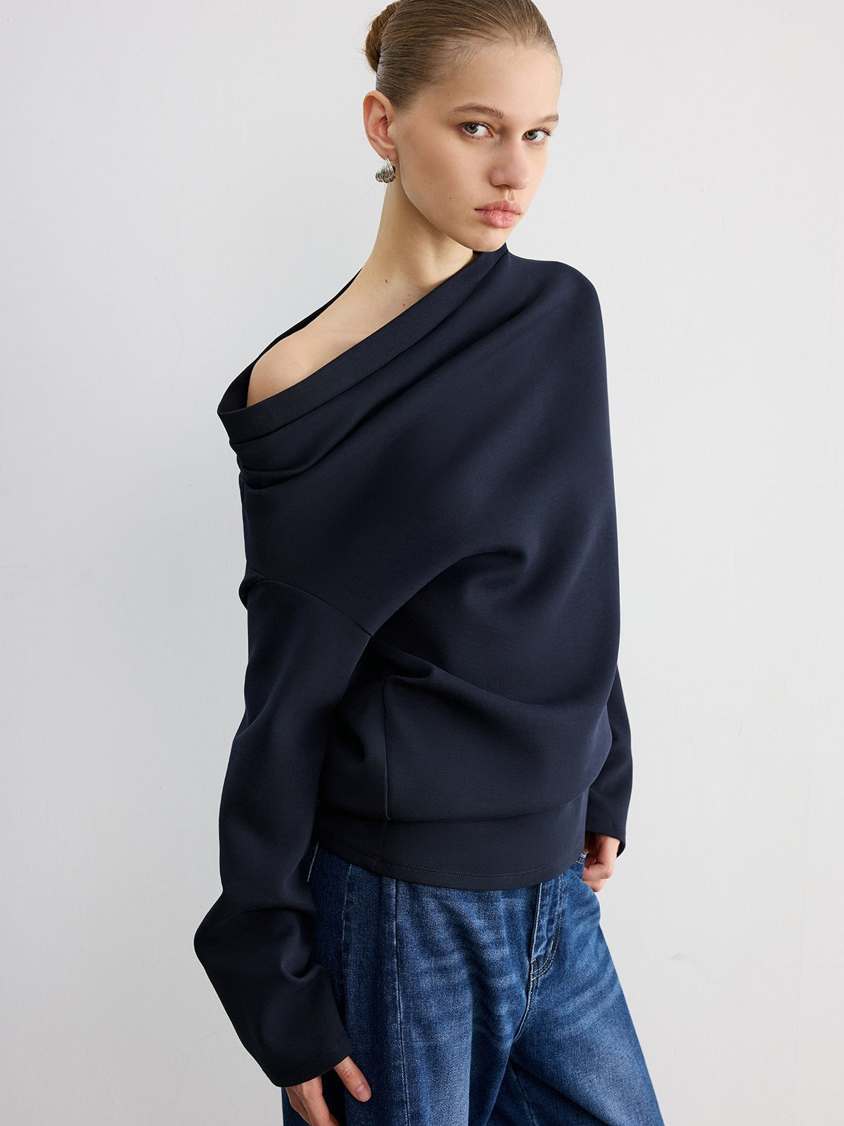 Augustine navy asymmetric off-shoulder sweatshirt, front view of the bare shoulder