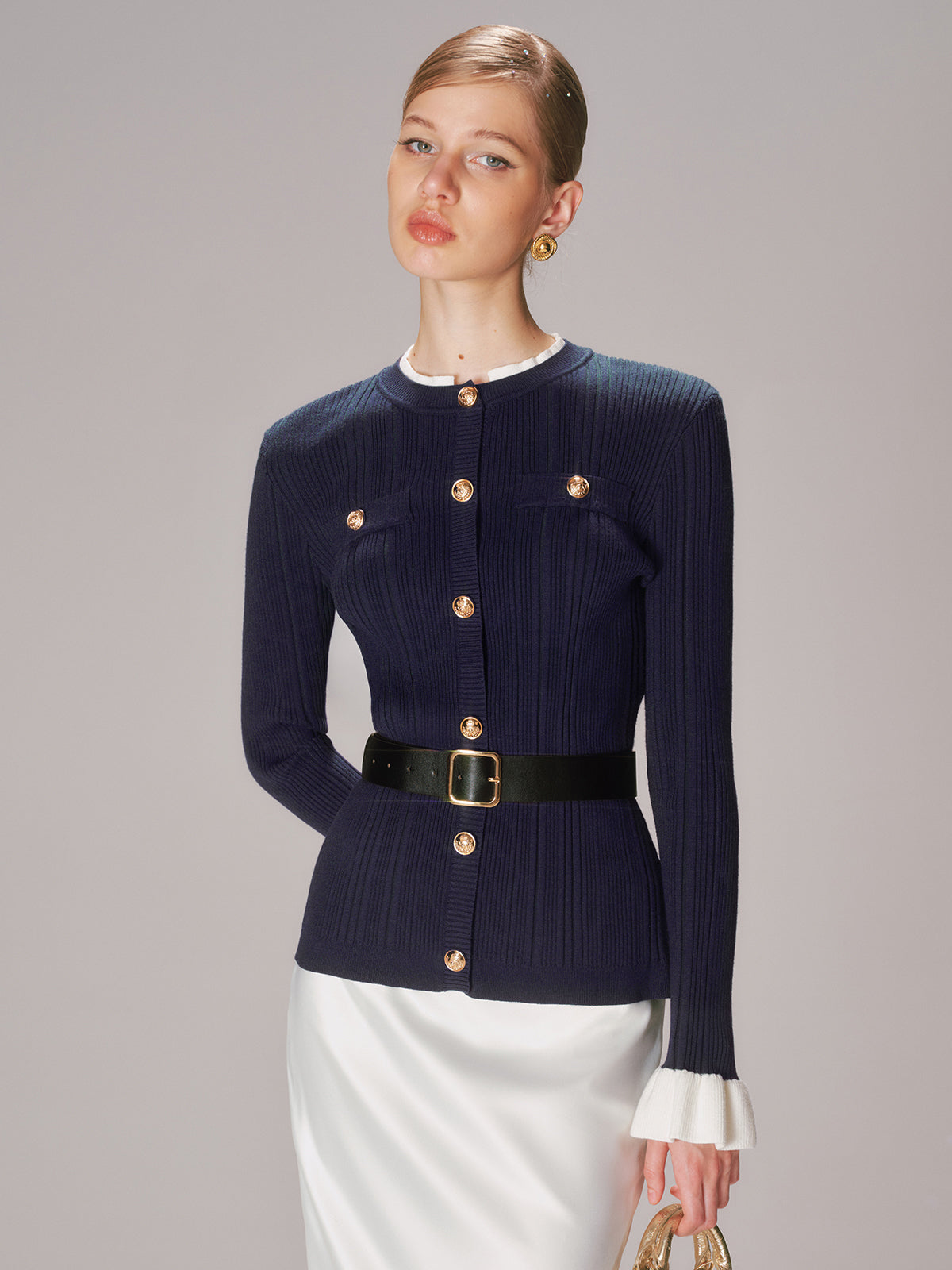 Beatrice navy ribbed knit cardigan, seated front view