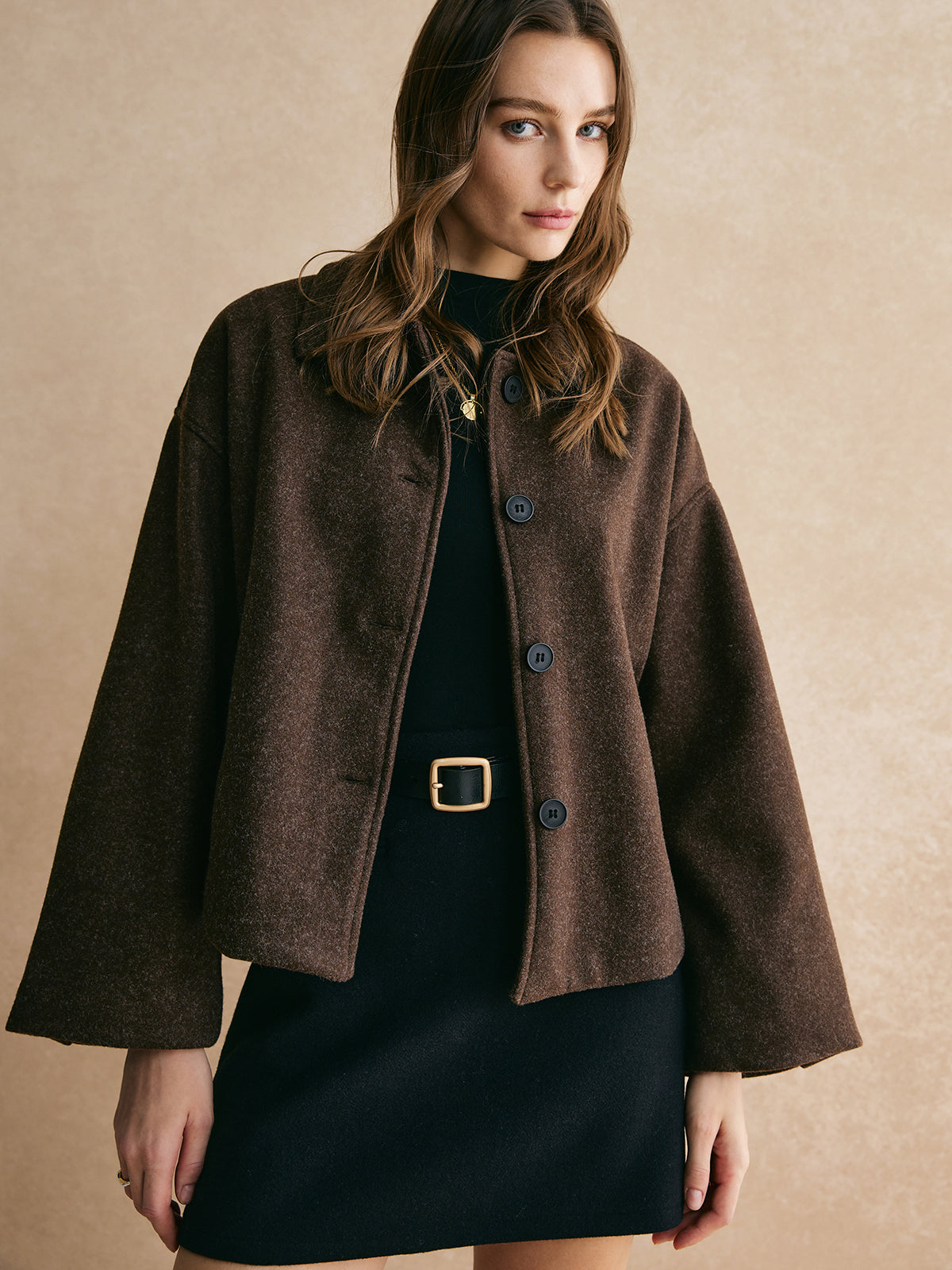 Bettina brown oversized button-front jacket with wide sleeves and buttons down the front, front view