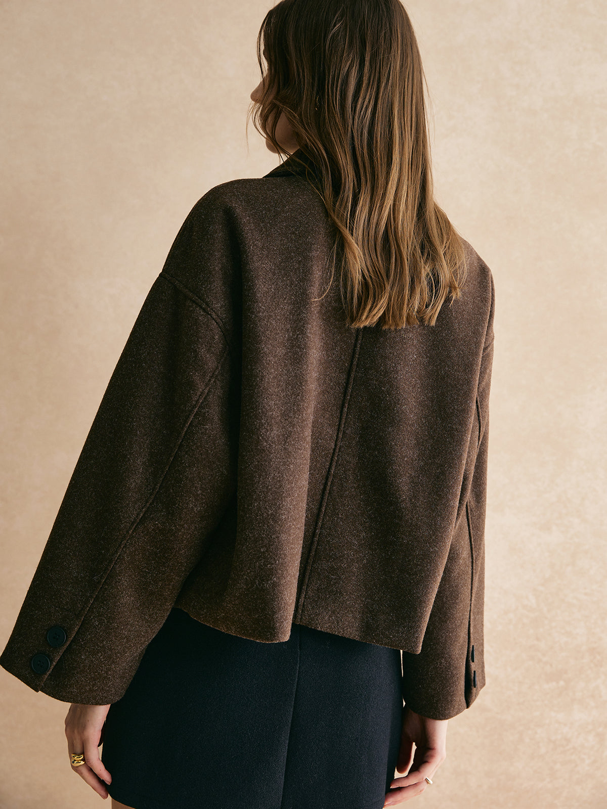 Bettina brown oversized button-front jacket, back view showing center seam and dropped shoulders
