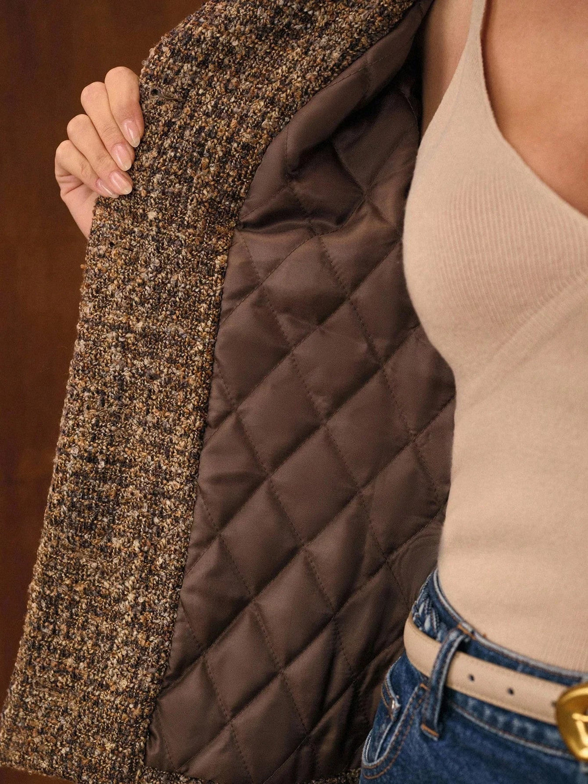 Close-up of the quilted lining inside the Camille tweed jacket