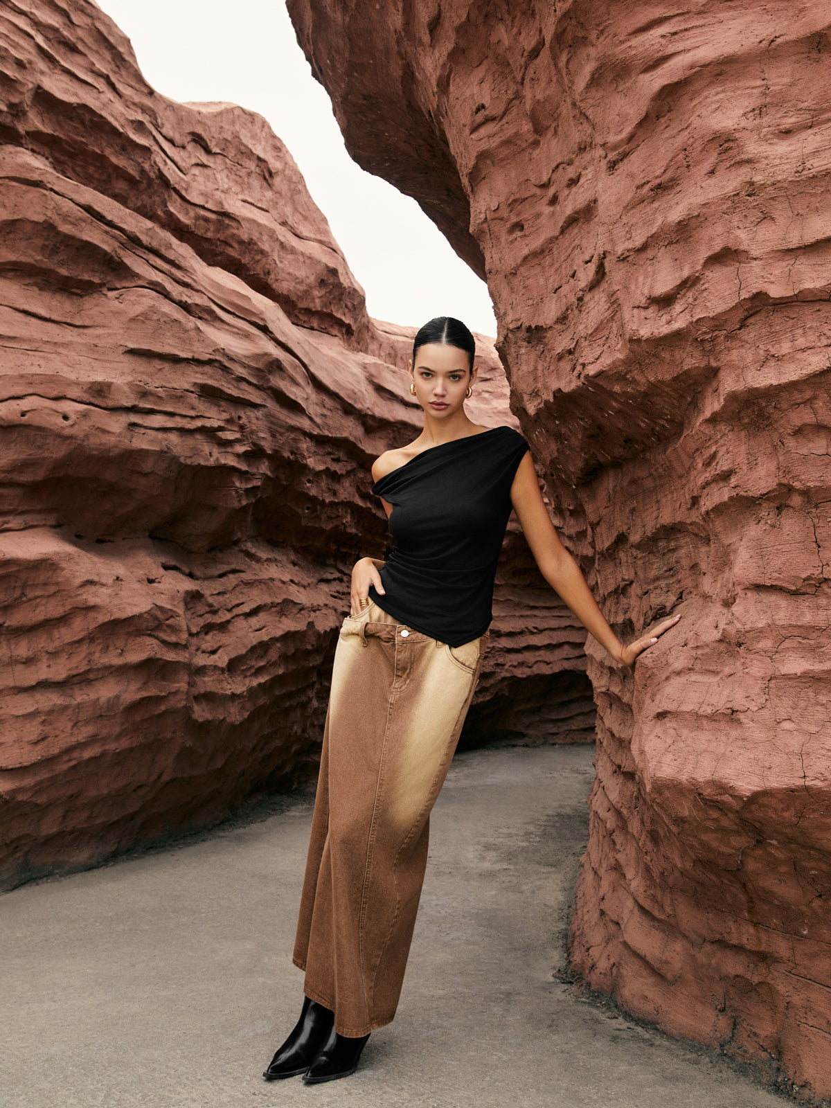 Capucine black one-shoulder draped top, side view