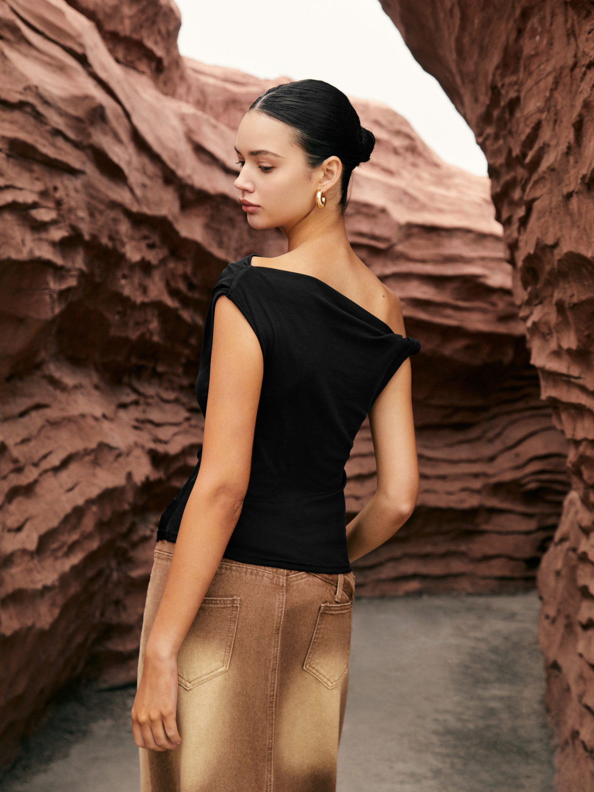 Capucine black one-shoulder draped top, back view