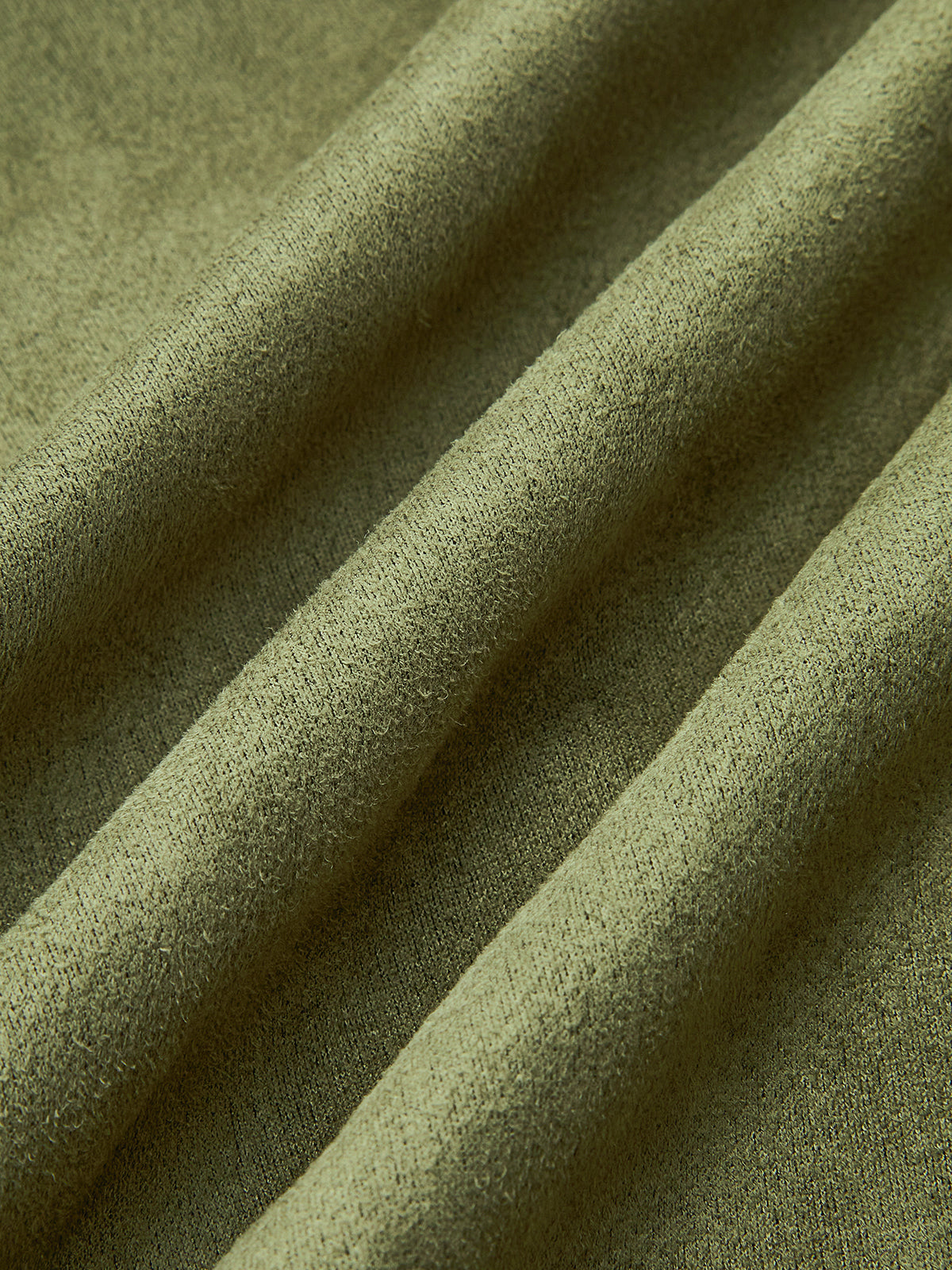 Charline green oversized wide-sleeve jacket, close-up of the soft matte surface and folds