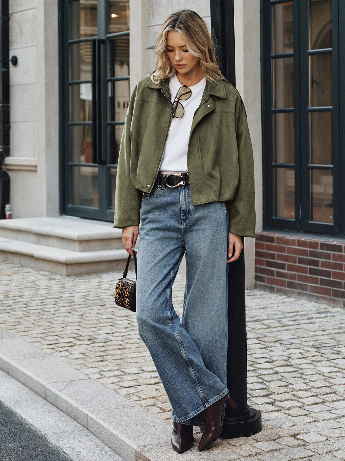 Charline green oversized wide-sleeve jacket worn open on the street, full-length view