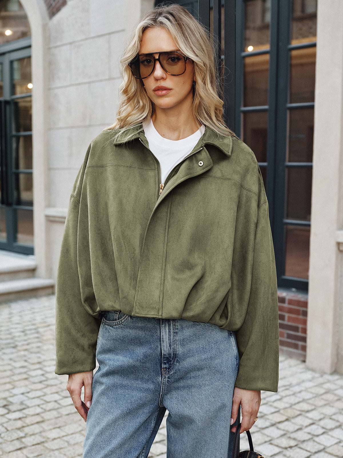 Charline green oversized wide-sleeve jacket with popped collar, waist-up front view