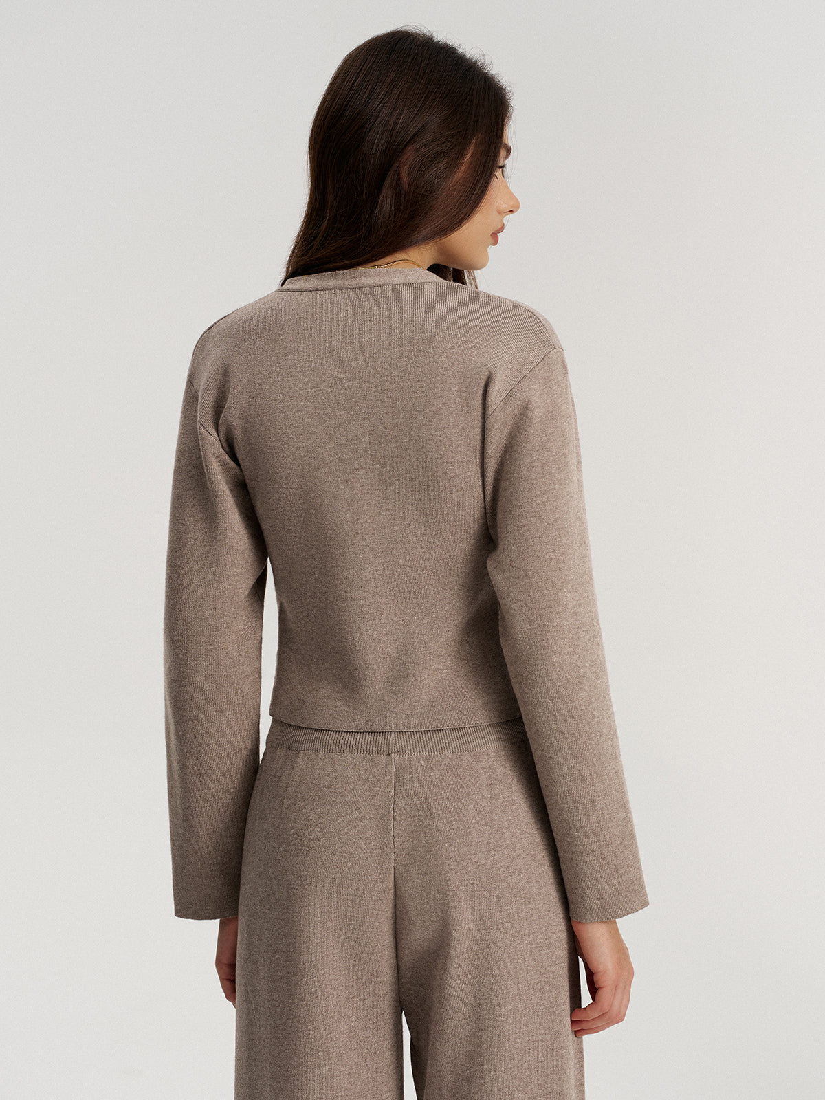 Back view of the taupe fitted knit cardigan